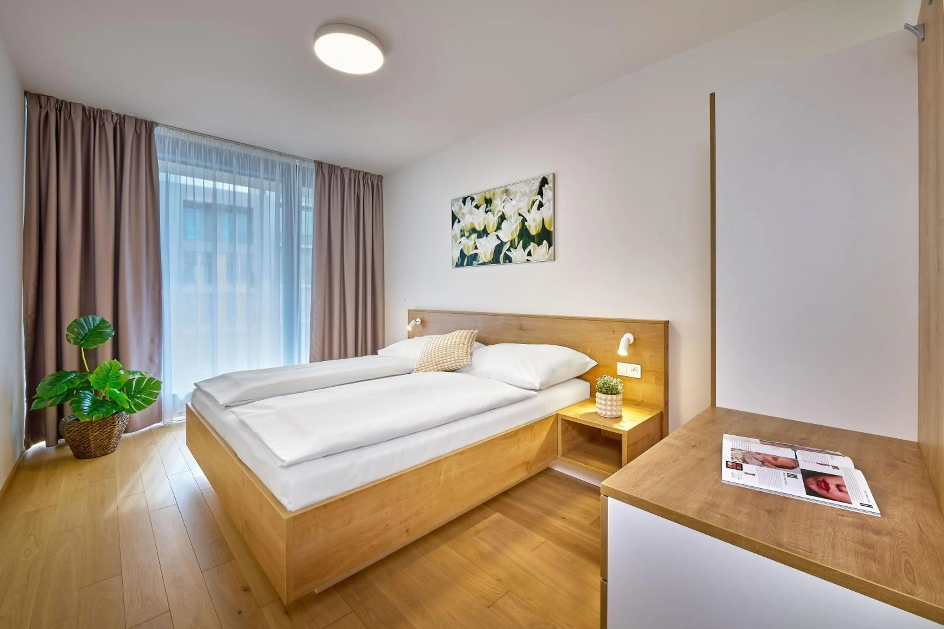 Bed in DownTown Suites Andel