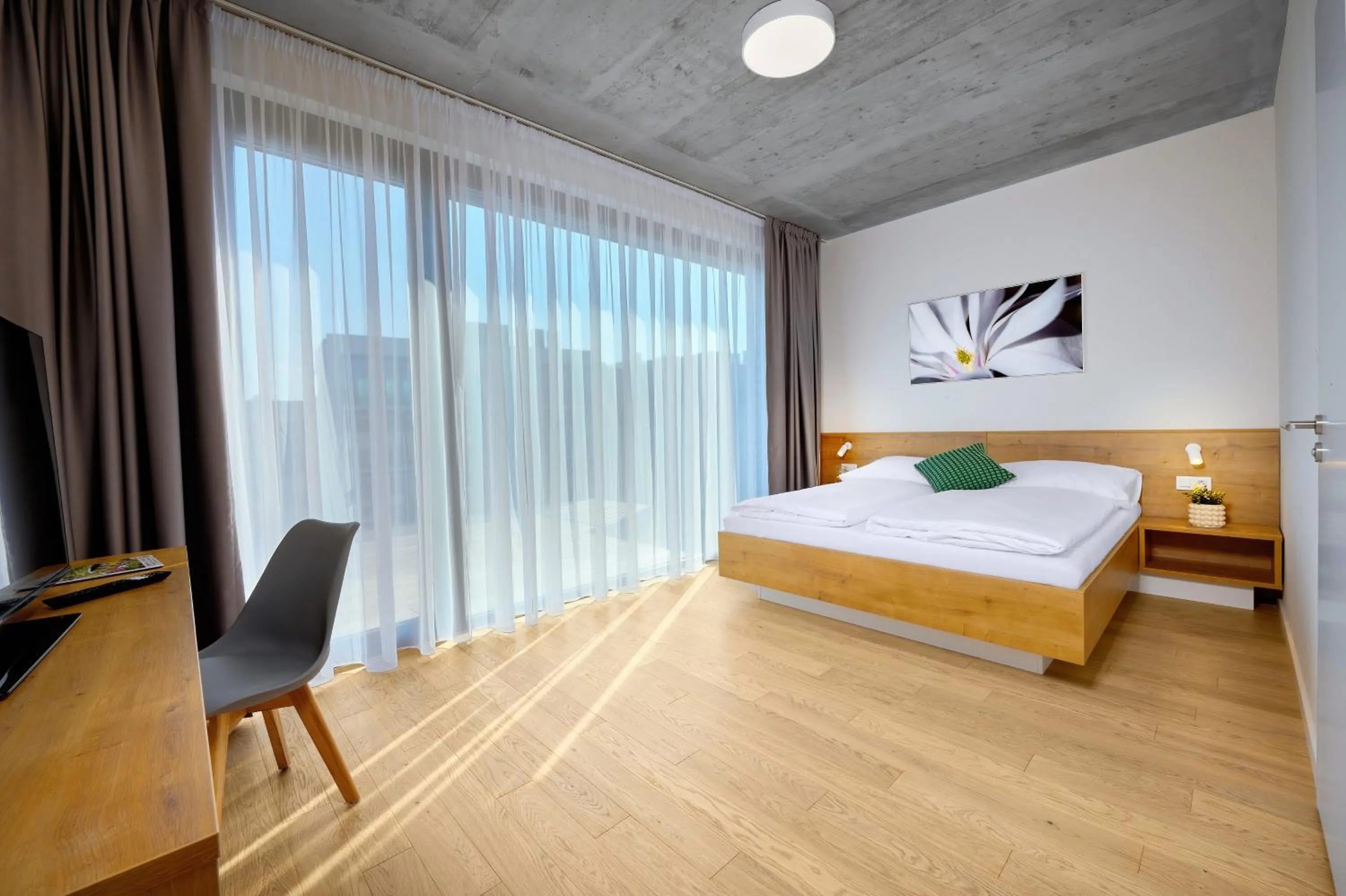 Bed in DownTown Suites Andel