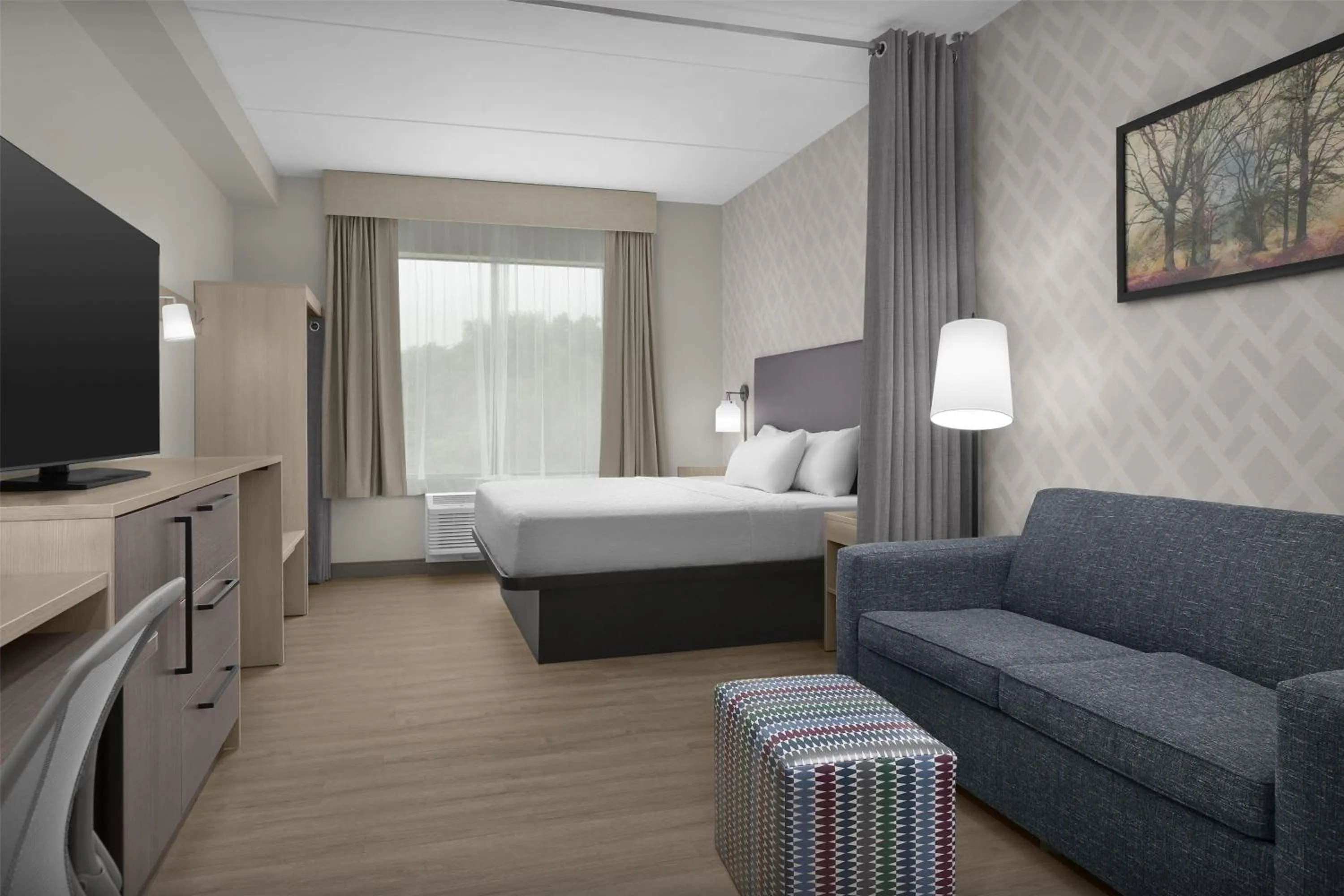 Living room, Bed in Home2 Suites By Hilton Sevierville