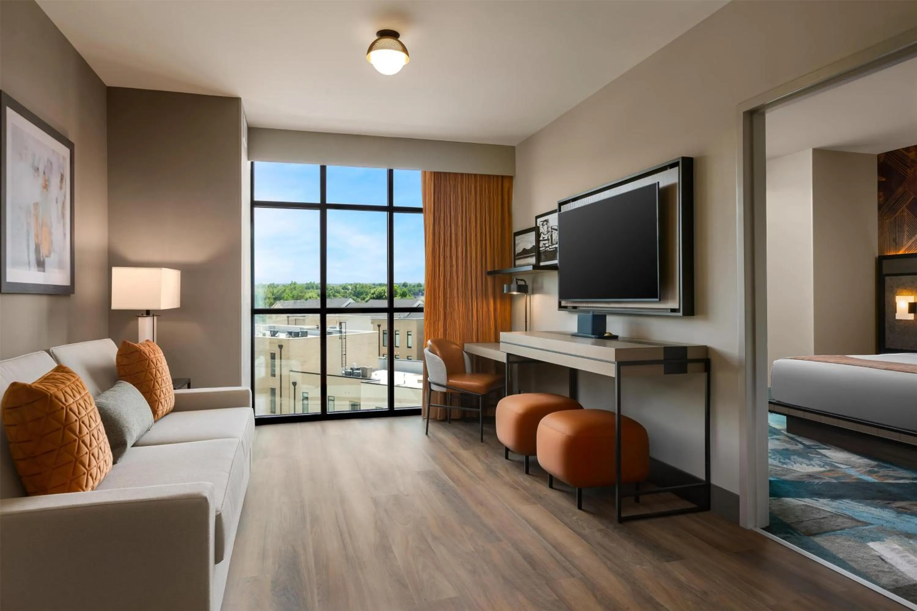 Living room, Bed in Hotel Avail Rogers, Tapestry Collection By Hilton