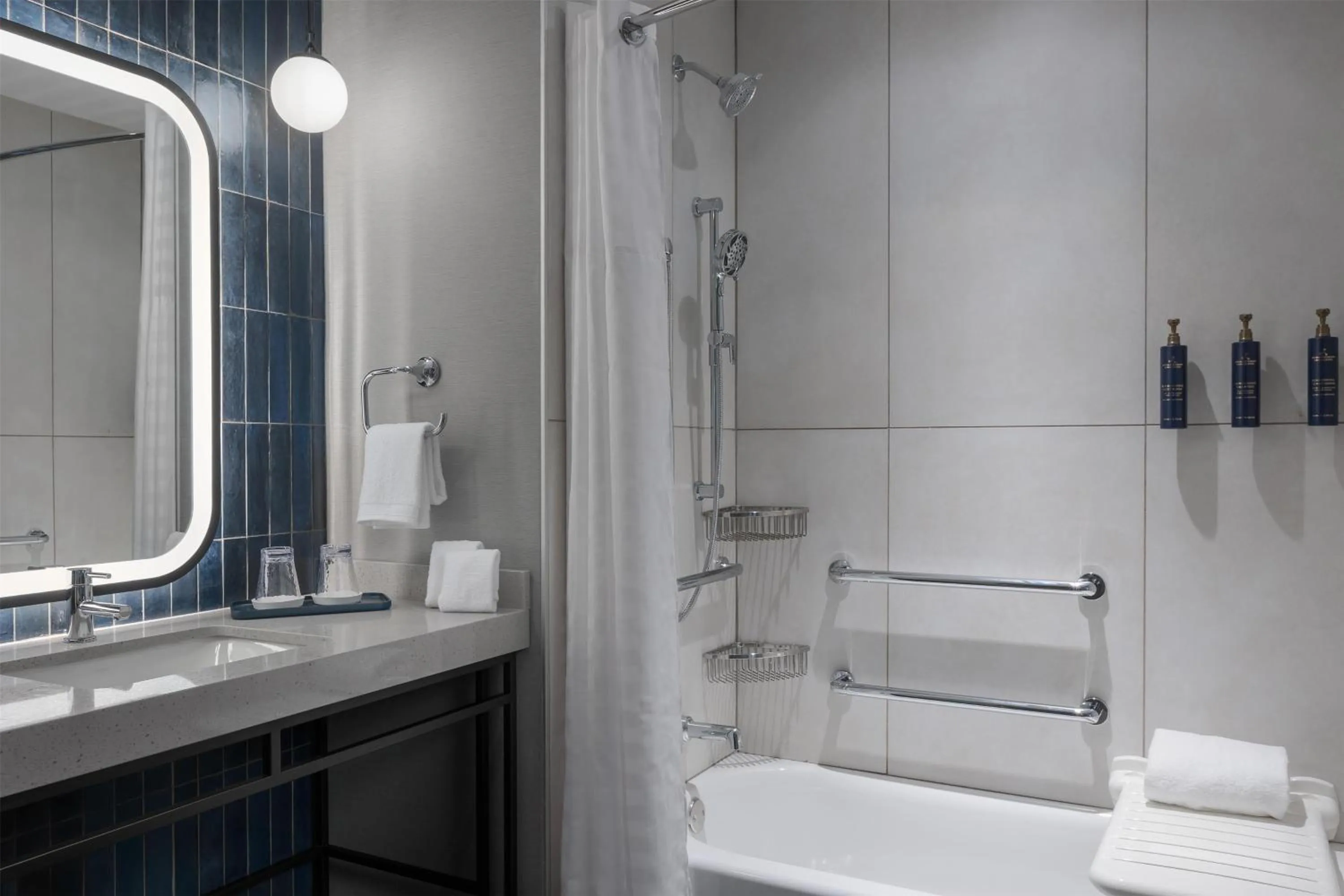 Bathroom in Hotel Avail Rogers, Tapestry Collection By Hilton