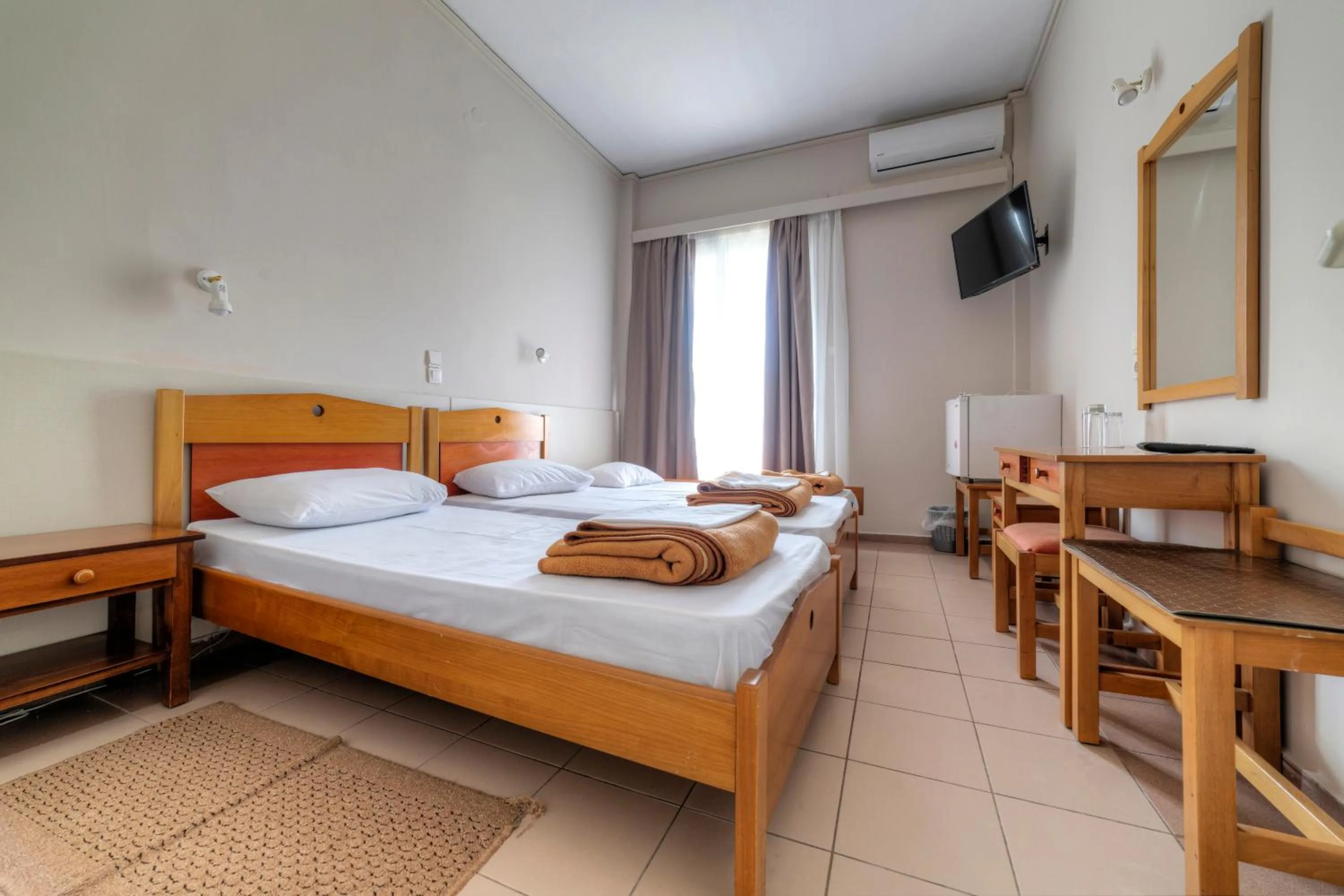 Bed in Delfini Hotel