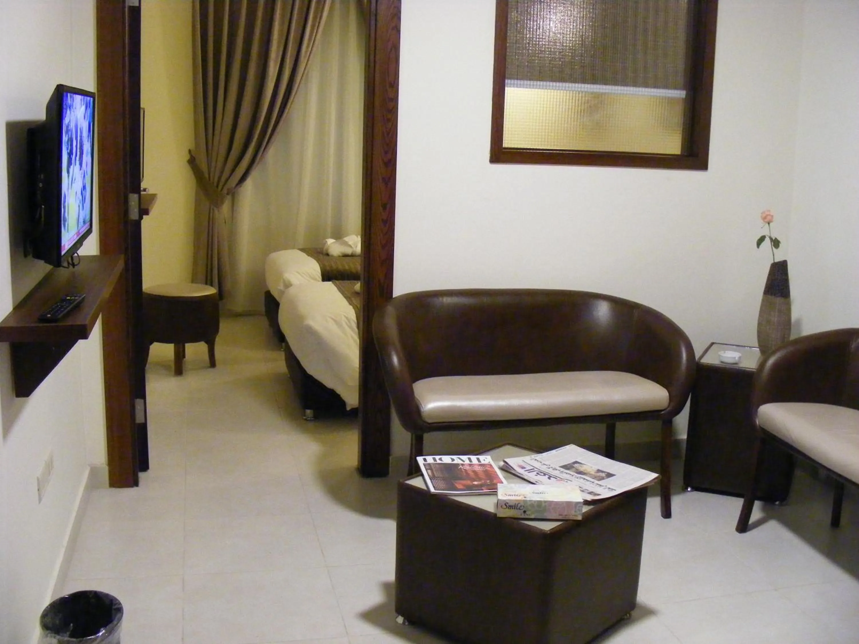 Living room, Bed in Ream Hotel Amman