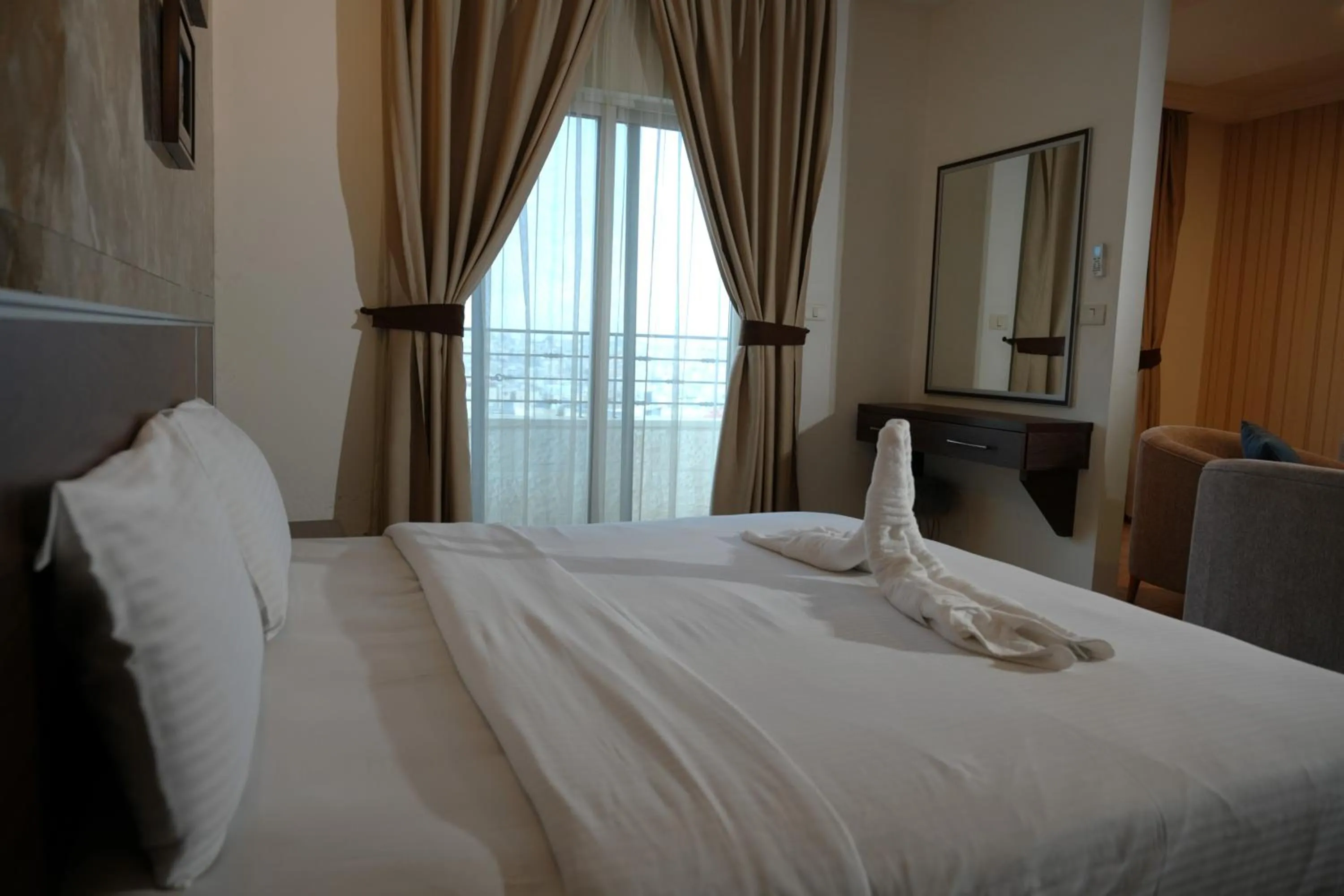 Bed in Ream Hotel Amman