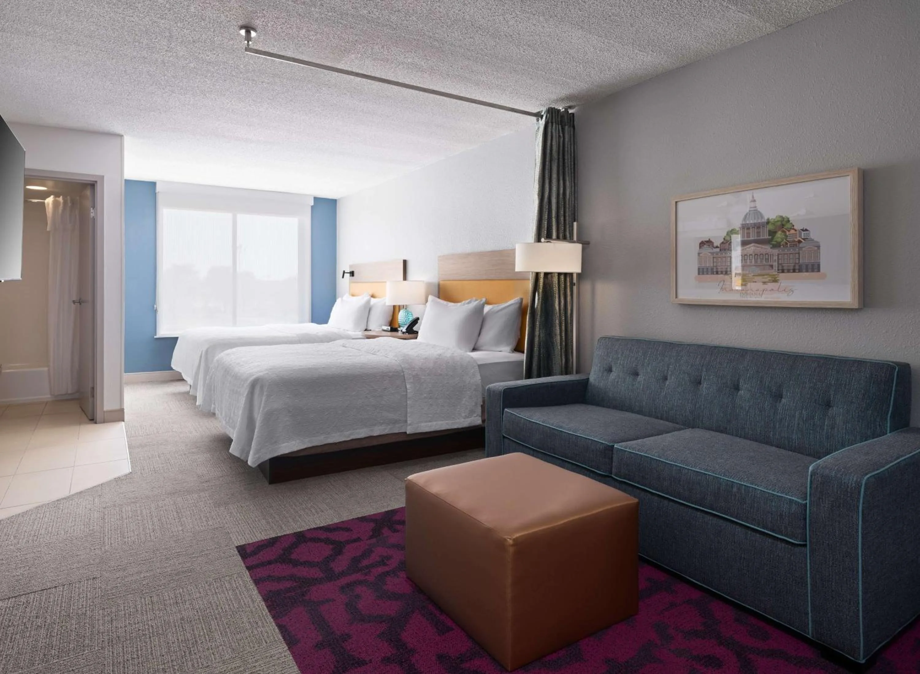 Living room, Bed in Home2 Suites by Hilton Indianapolis - Keystone Crossing