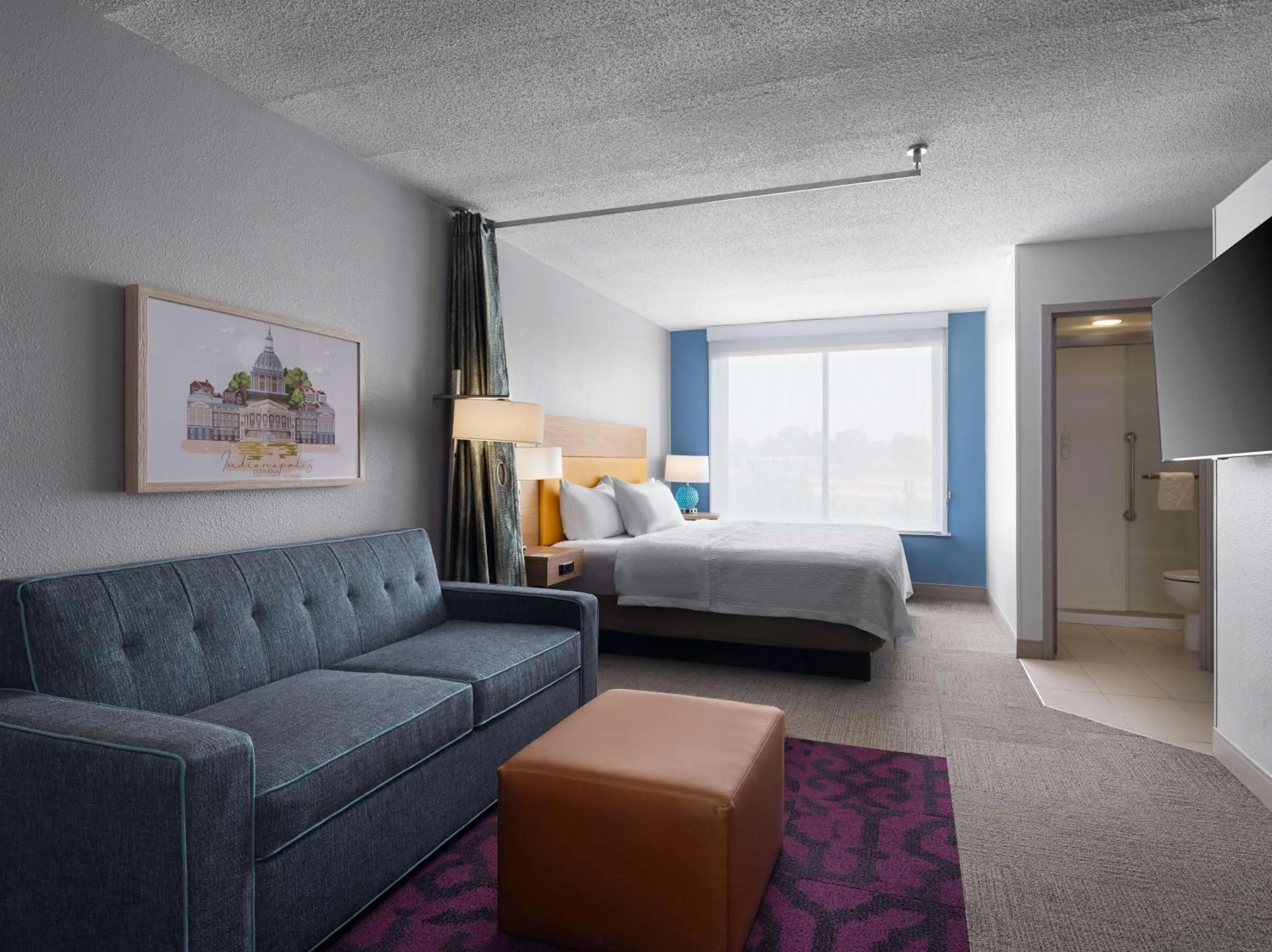 Living room, Bed in Home2 Suites by Hilton Indianapolis - Keystone Crossing