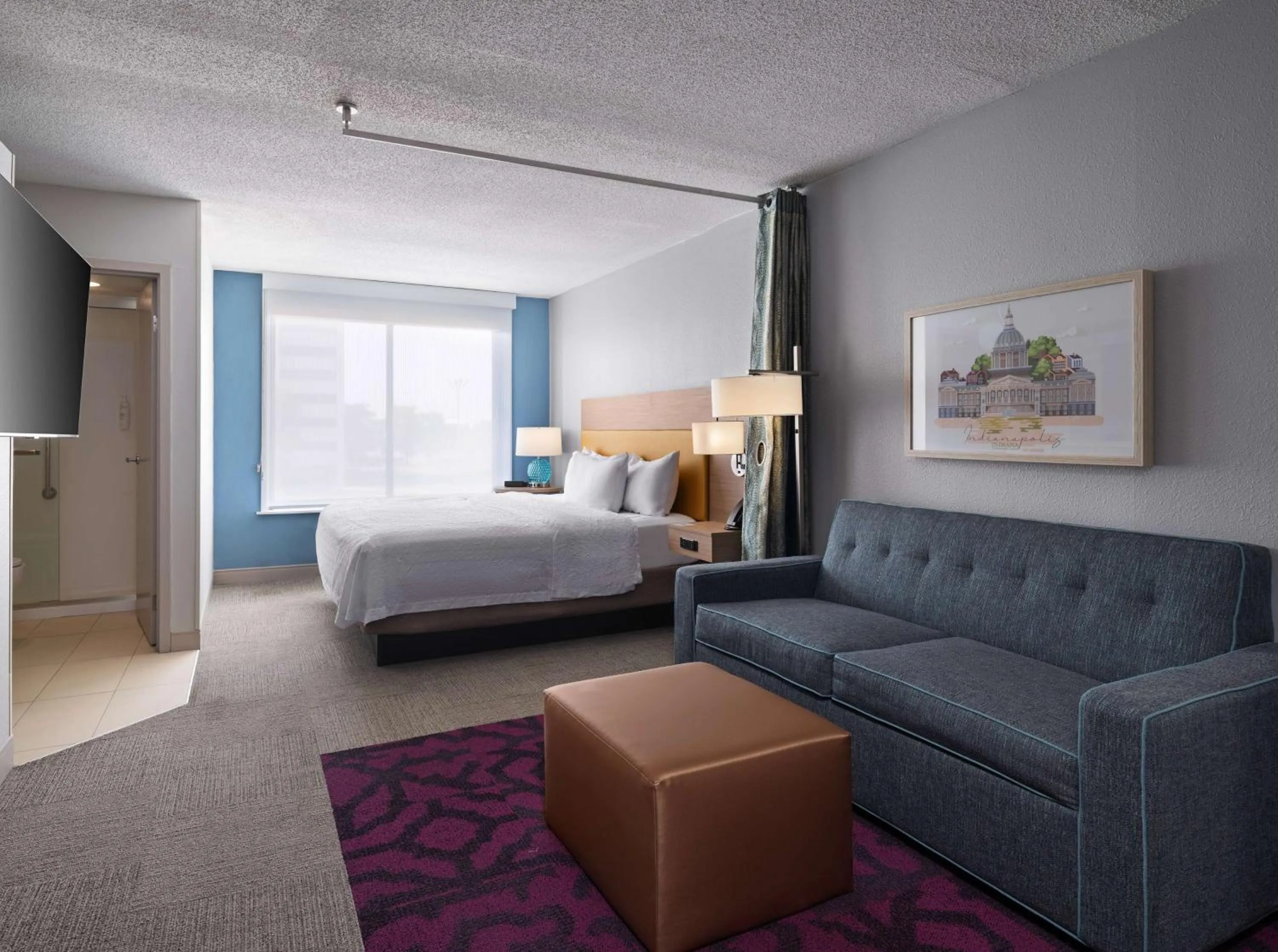 Living room, Bed in Home2 Suites by Hilton Indianapolis - Keystone Crossing