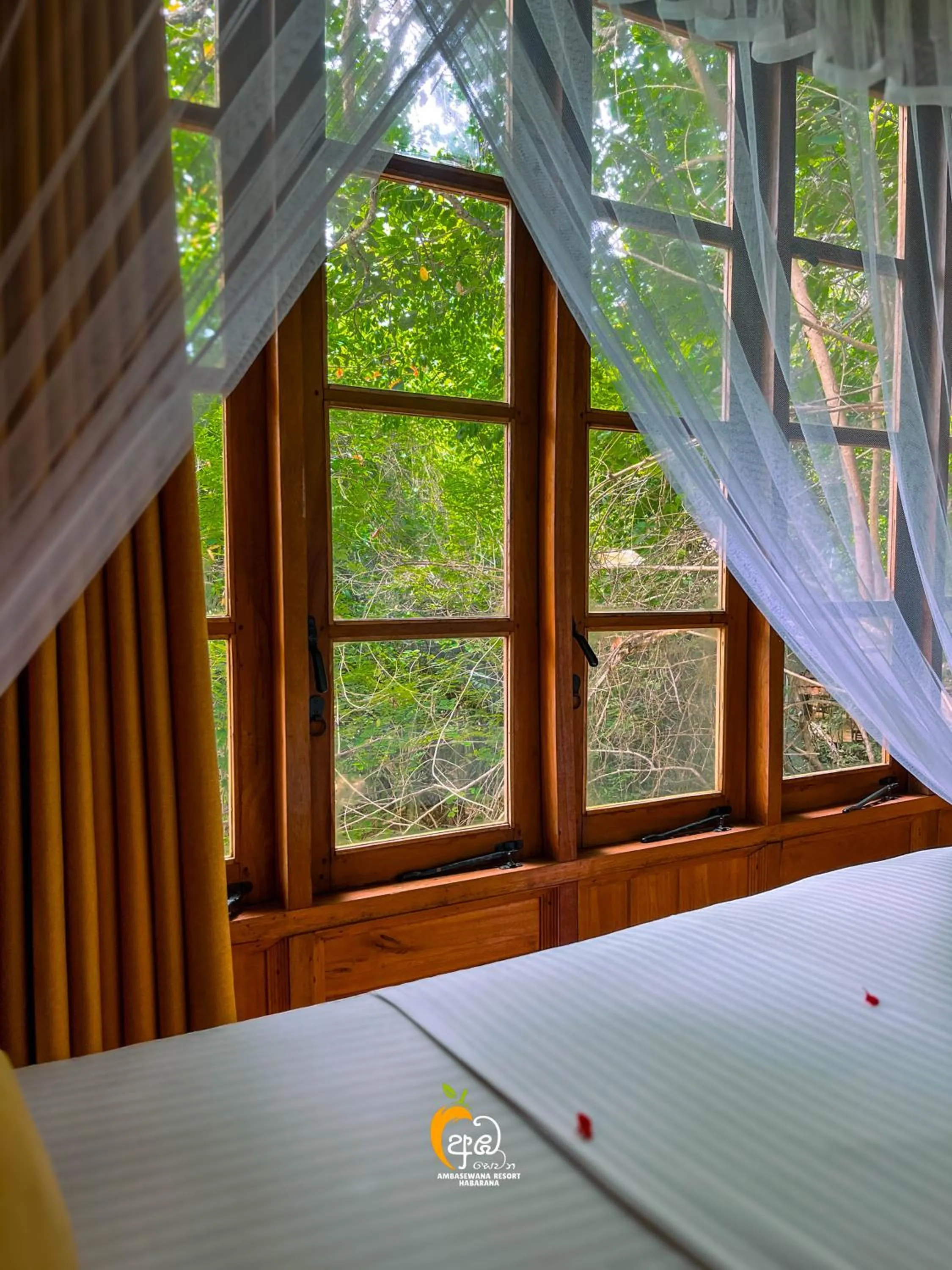 Bed in Habarana Tree House Ambasewana Resort
