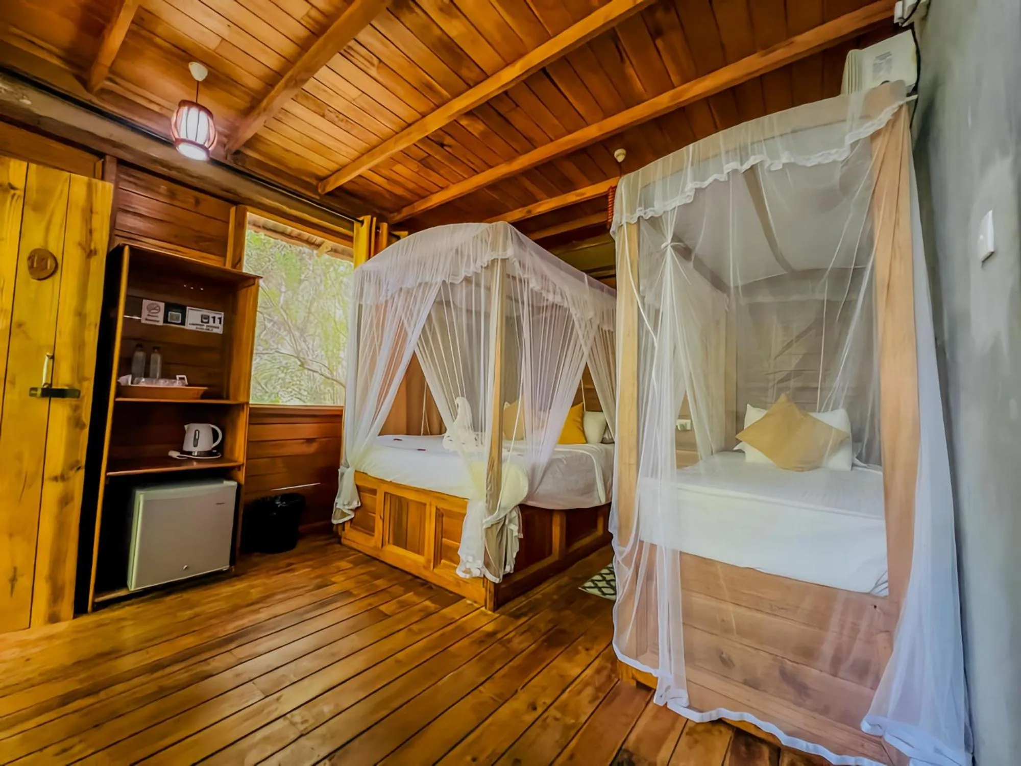 Bed in Habarana Tree House Ambasewana Resort