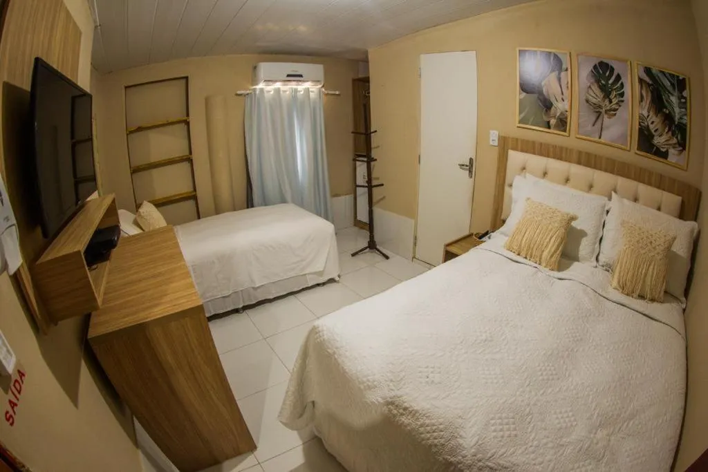 Bed in Pousada da Leide