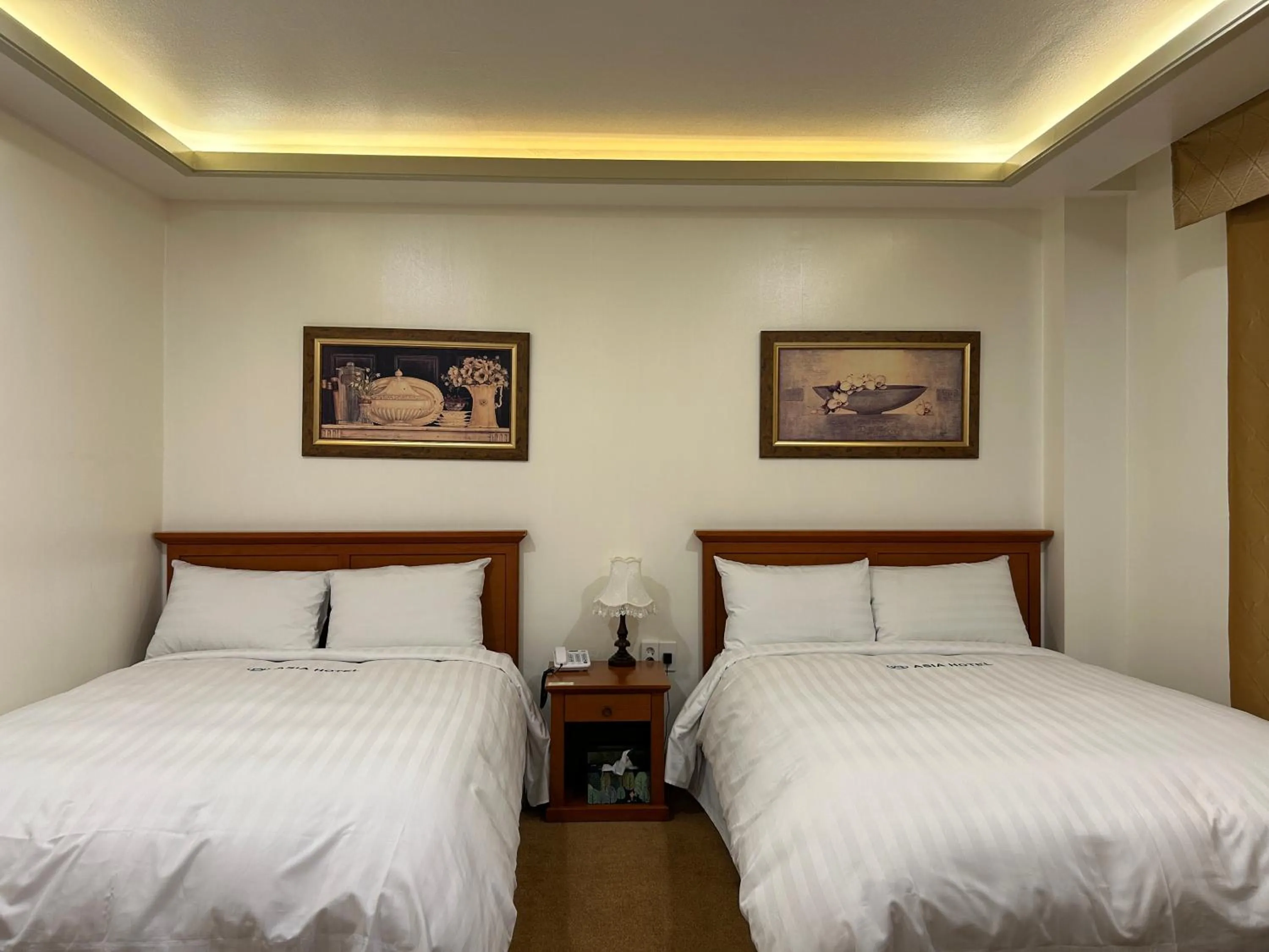 Bed in Asia Tourist Hotel