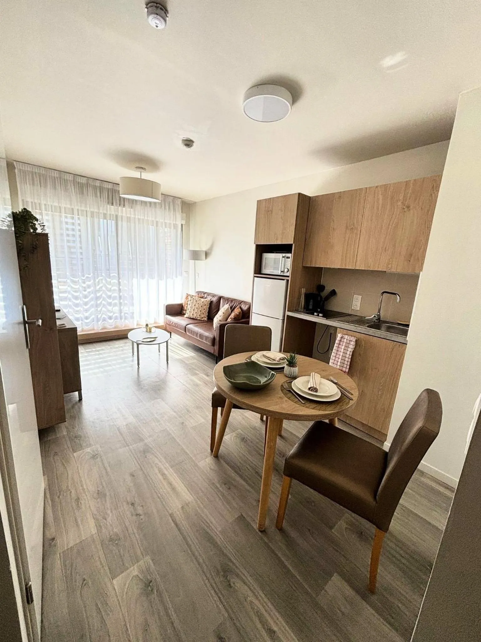 Kitchen or kitchenette in Zenao Appart'hôtels Cenon