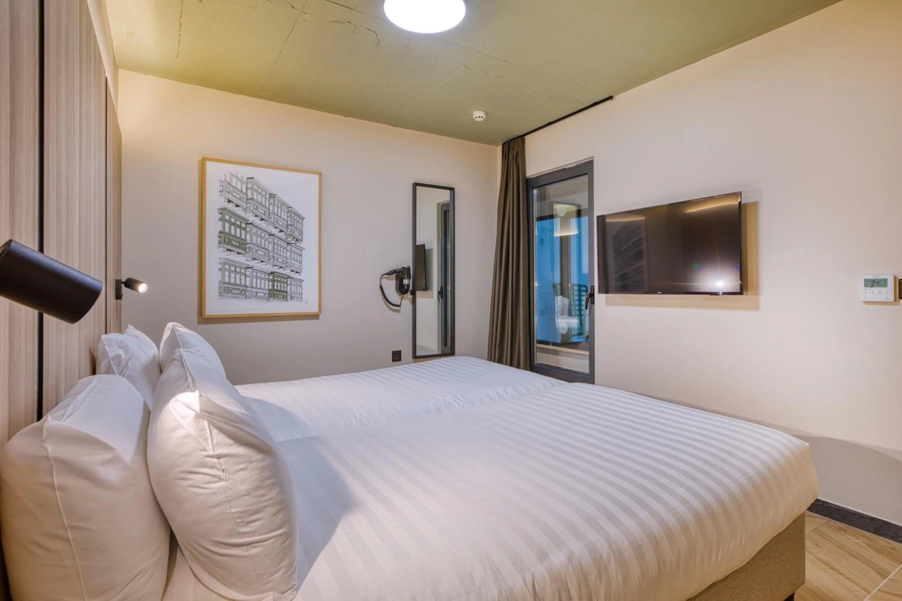 Bed in VITA Hotel & Rooftop