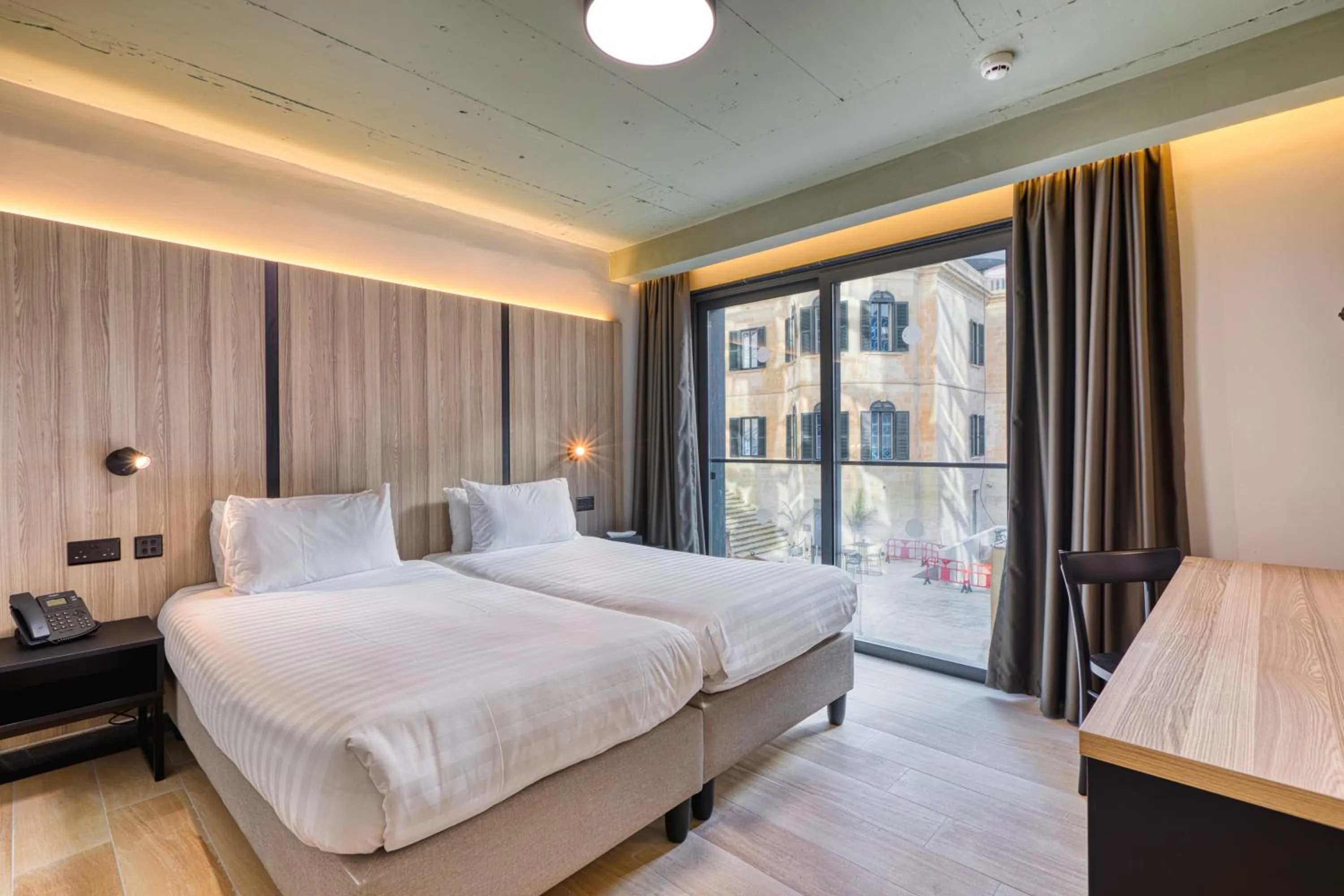 Bed in VITA Hotel & Rooftop