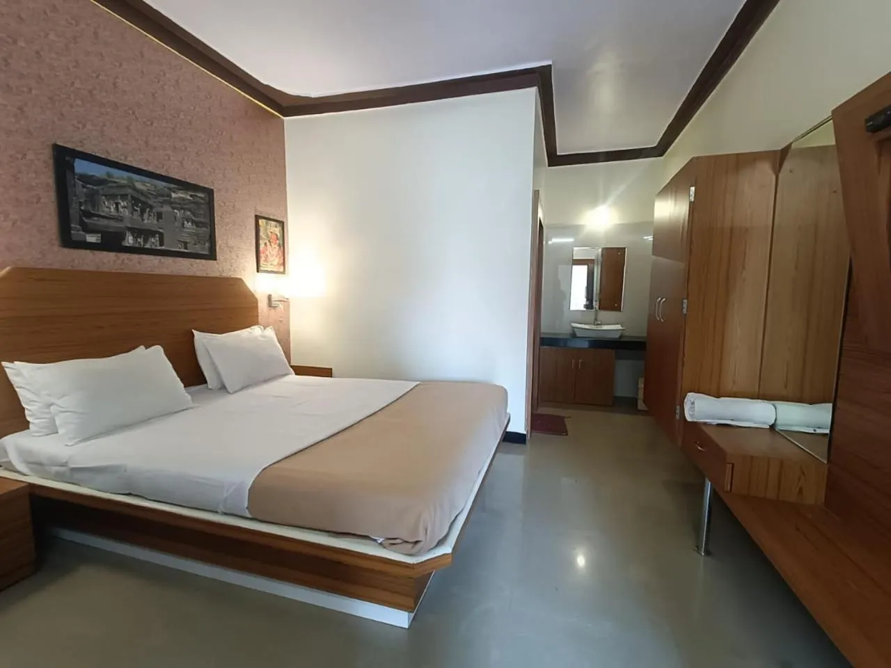 Bed in Ellora Heritage Resort