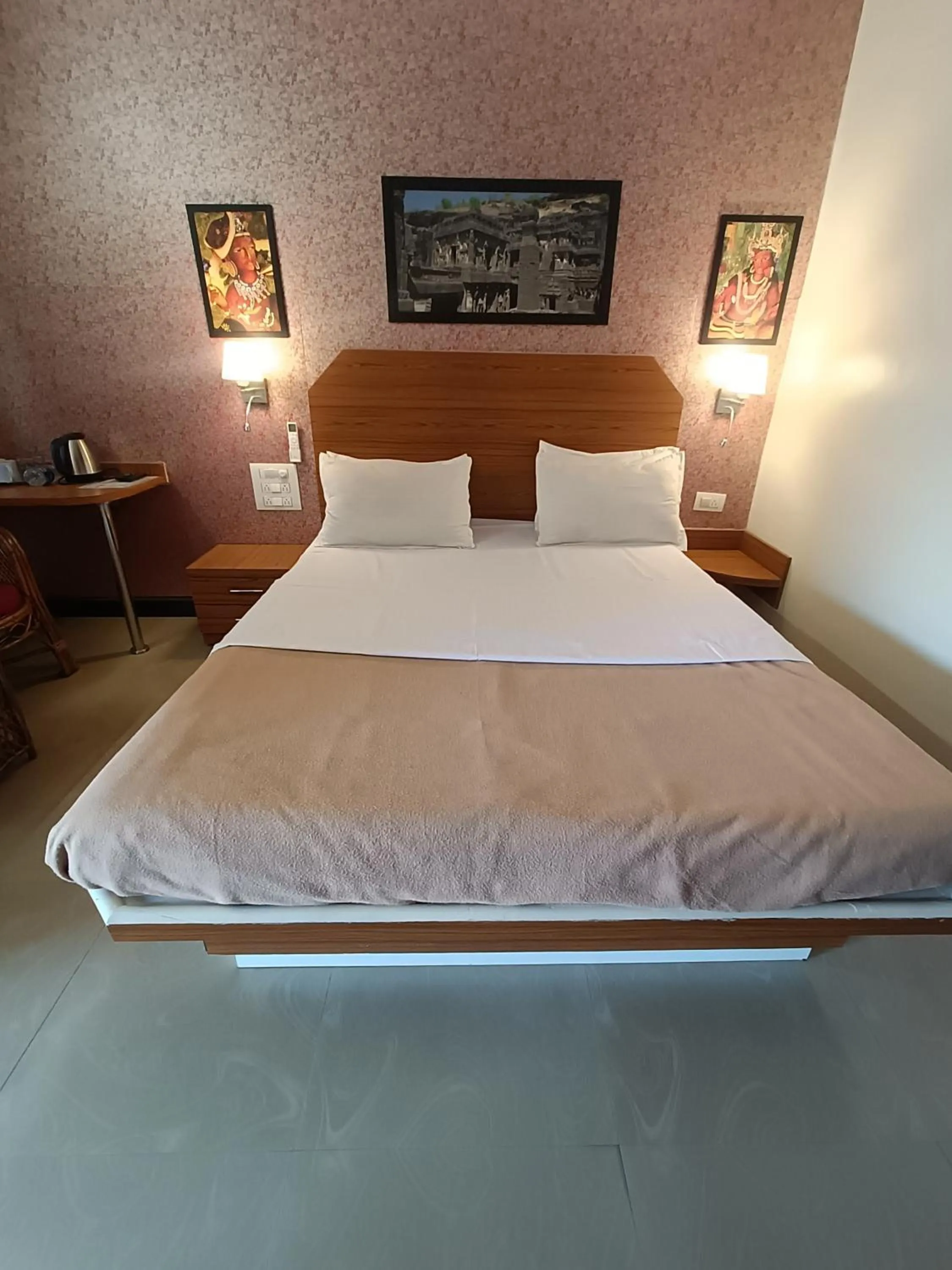 Bed in Ellora Heritage Resort