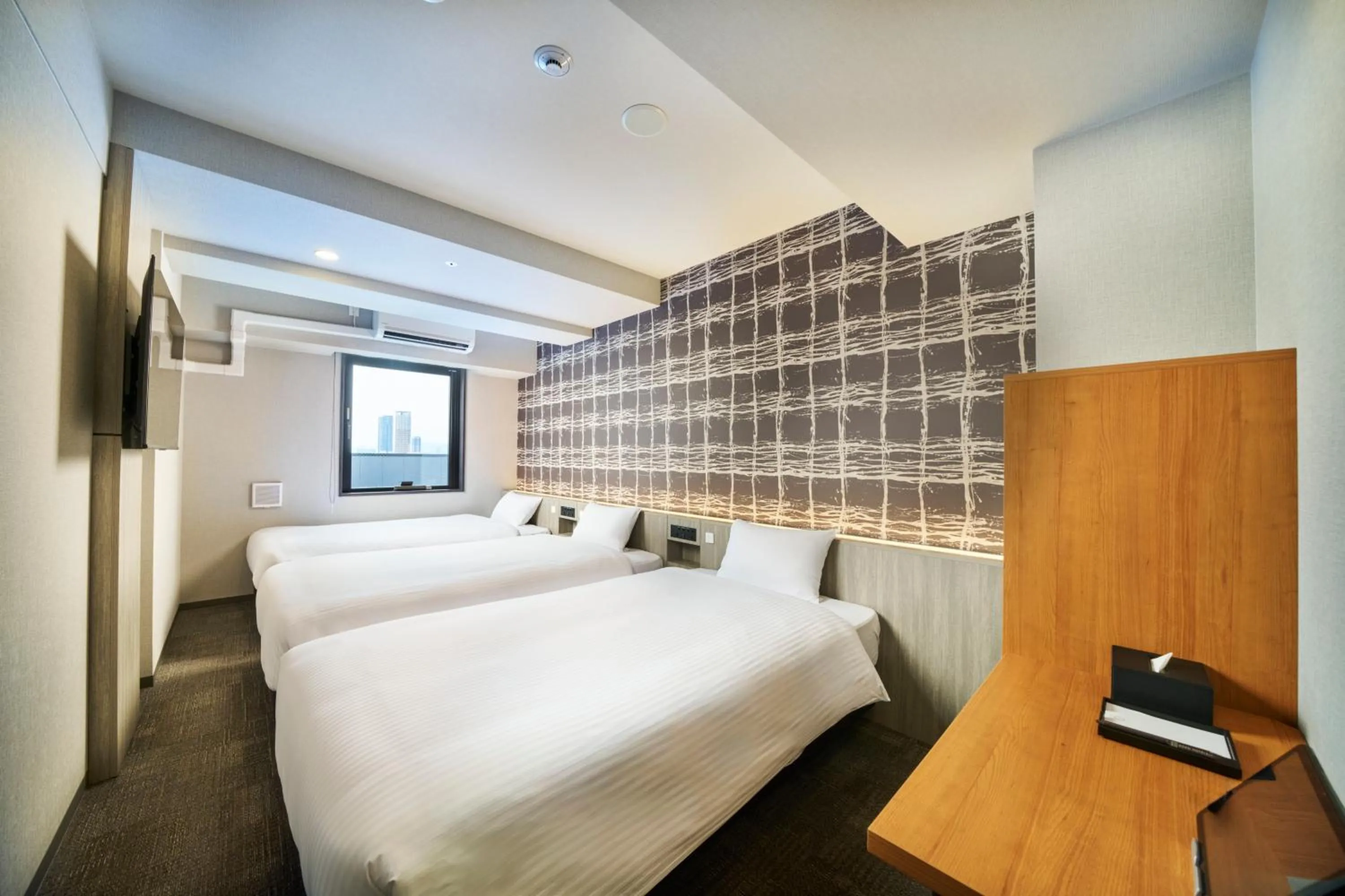 Photo of the whole room, Bed in KOKO HOTEL Osaka Namba Sennichimae