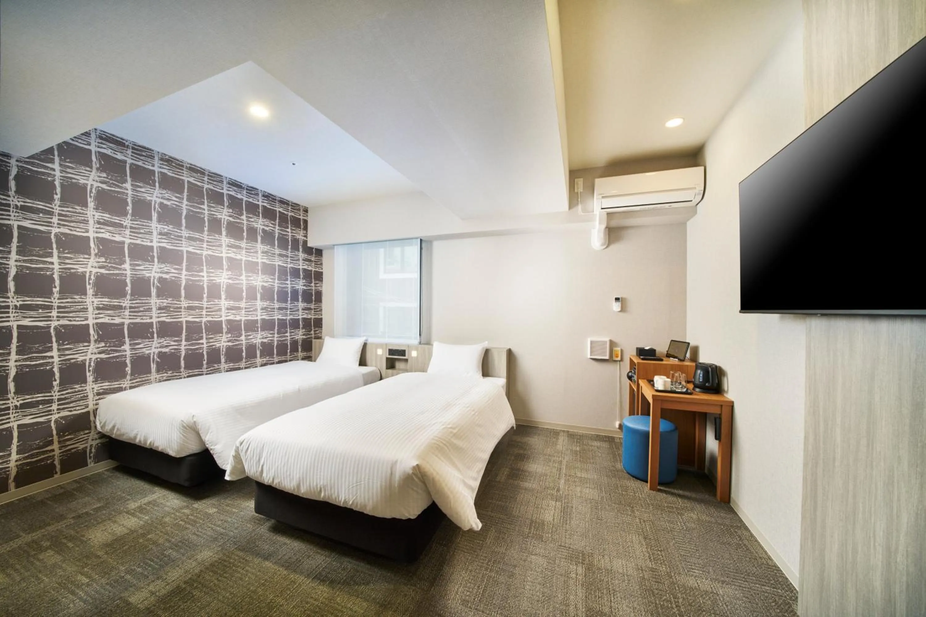 Photo of the whole room, Bed in KOKO HOTEL Osaka Namba Sennichimae