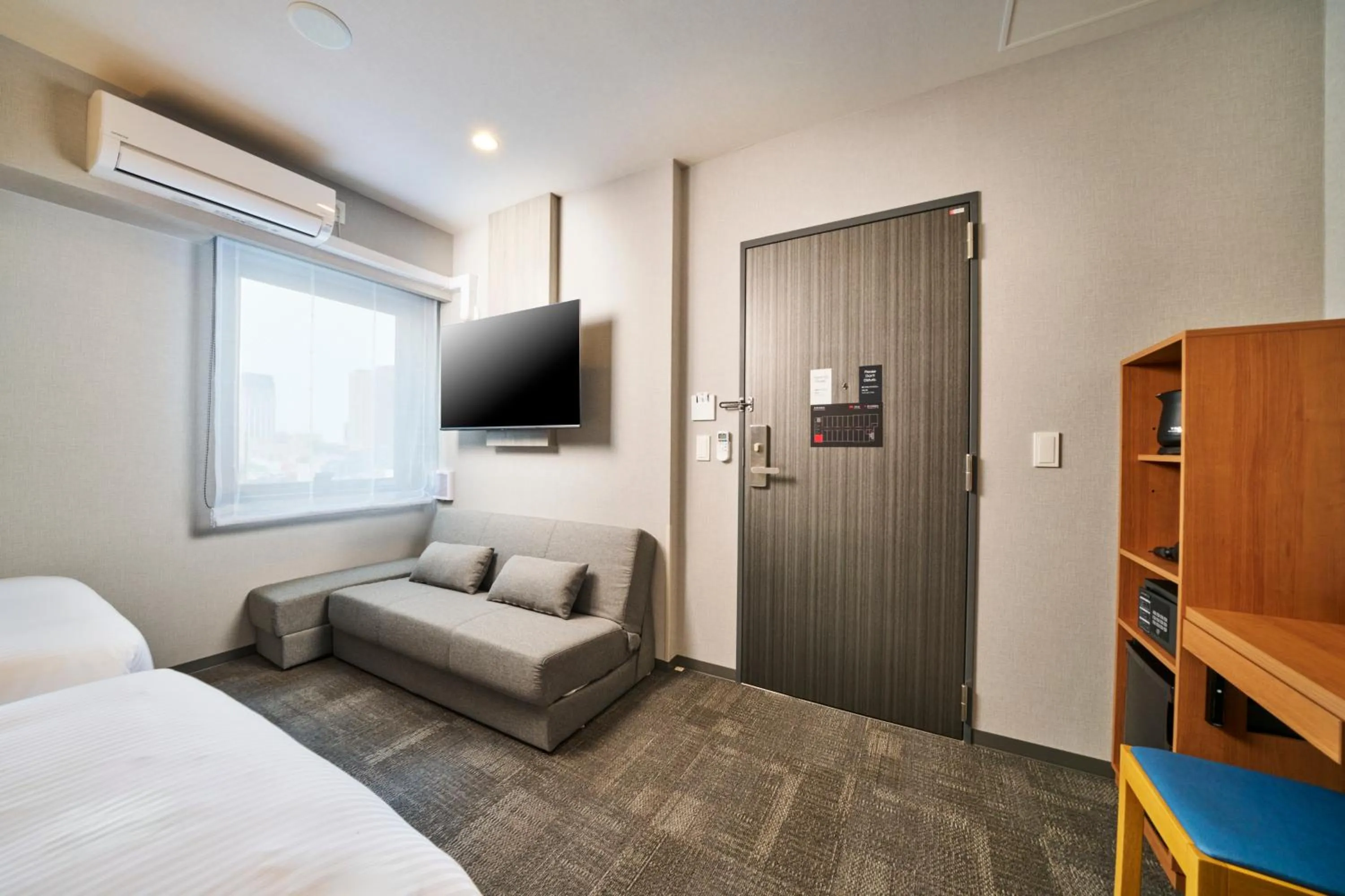 Photo of the whole room, Bed in KOKO HOTEL Osaka Namba Sennichimae