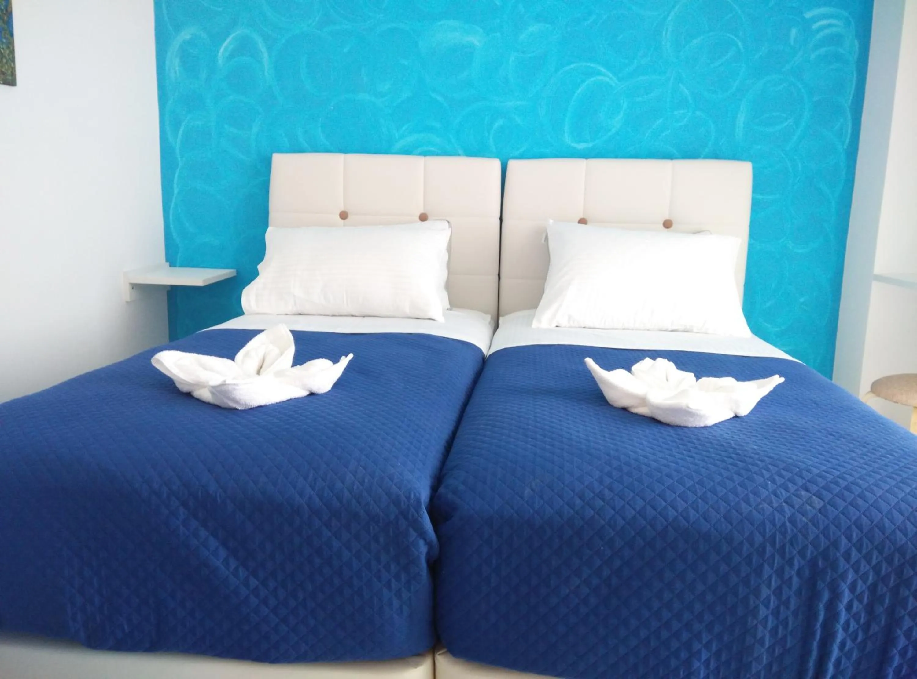 Bed in Poseidon Apartments