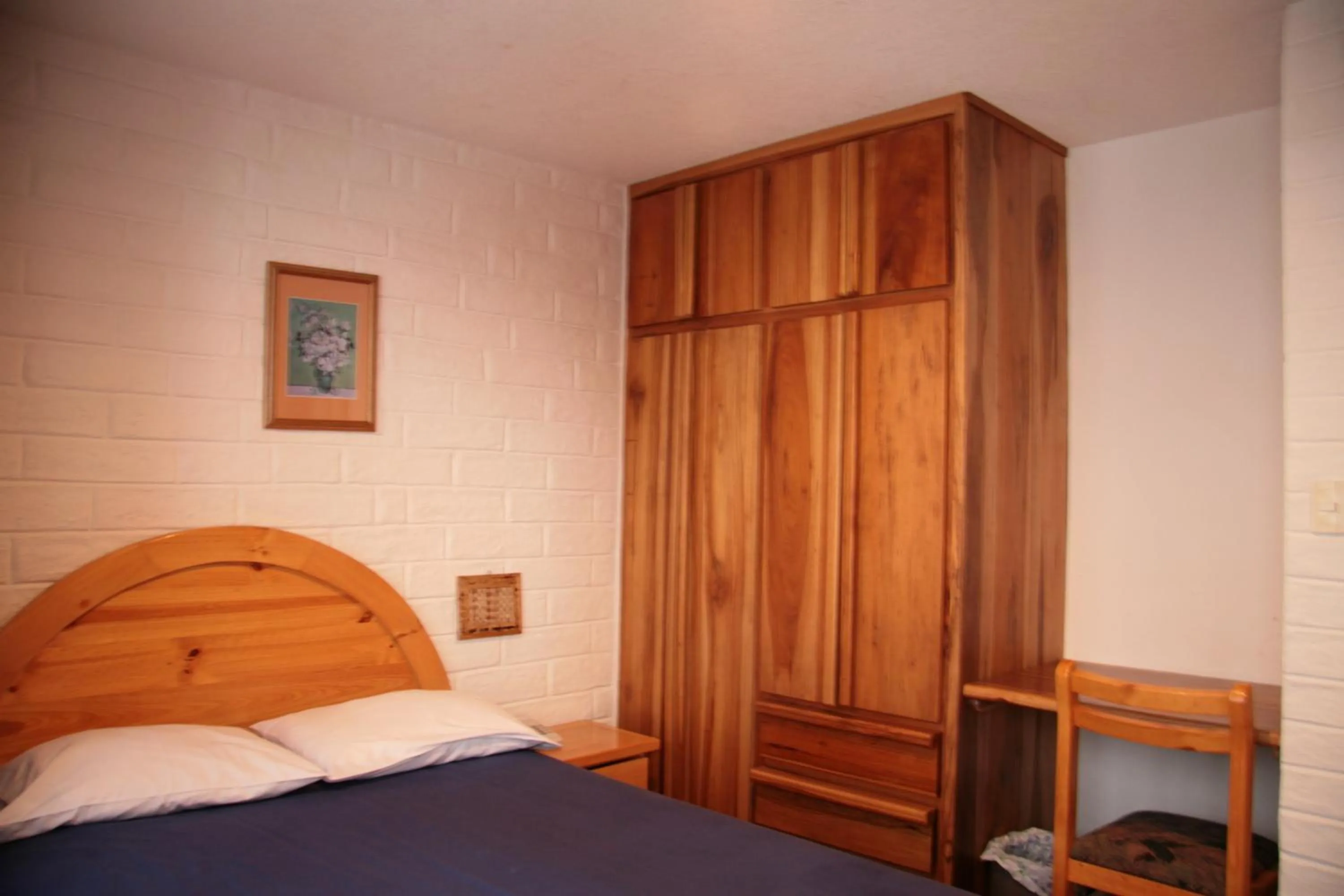 Bed in Apartamentos Los Quipus