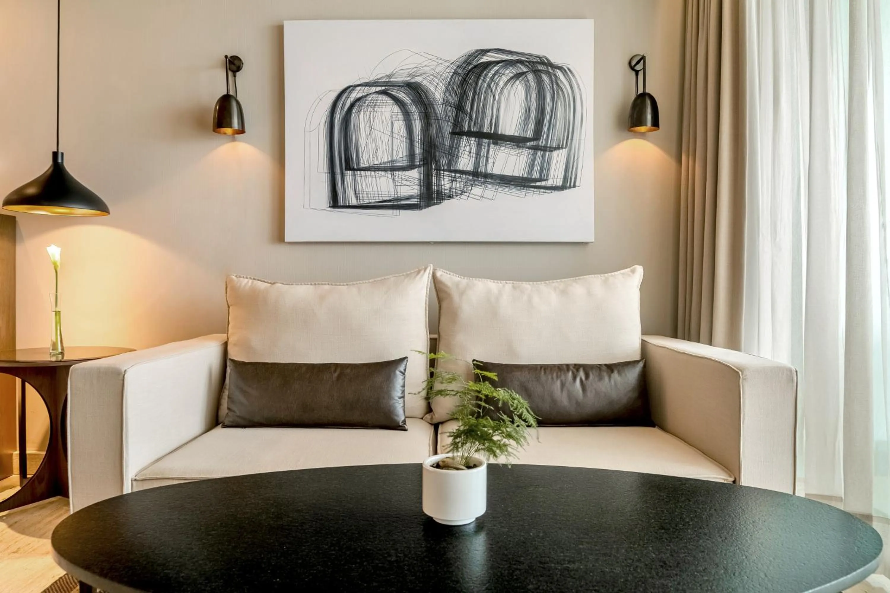 Living room in Thompson Playa Del Carmen Main House, by Hyatt