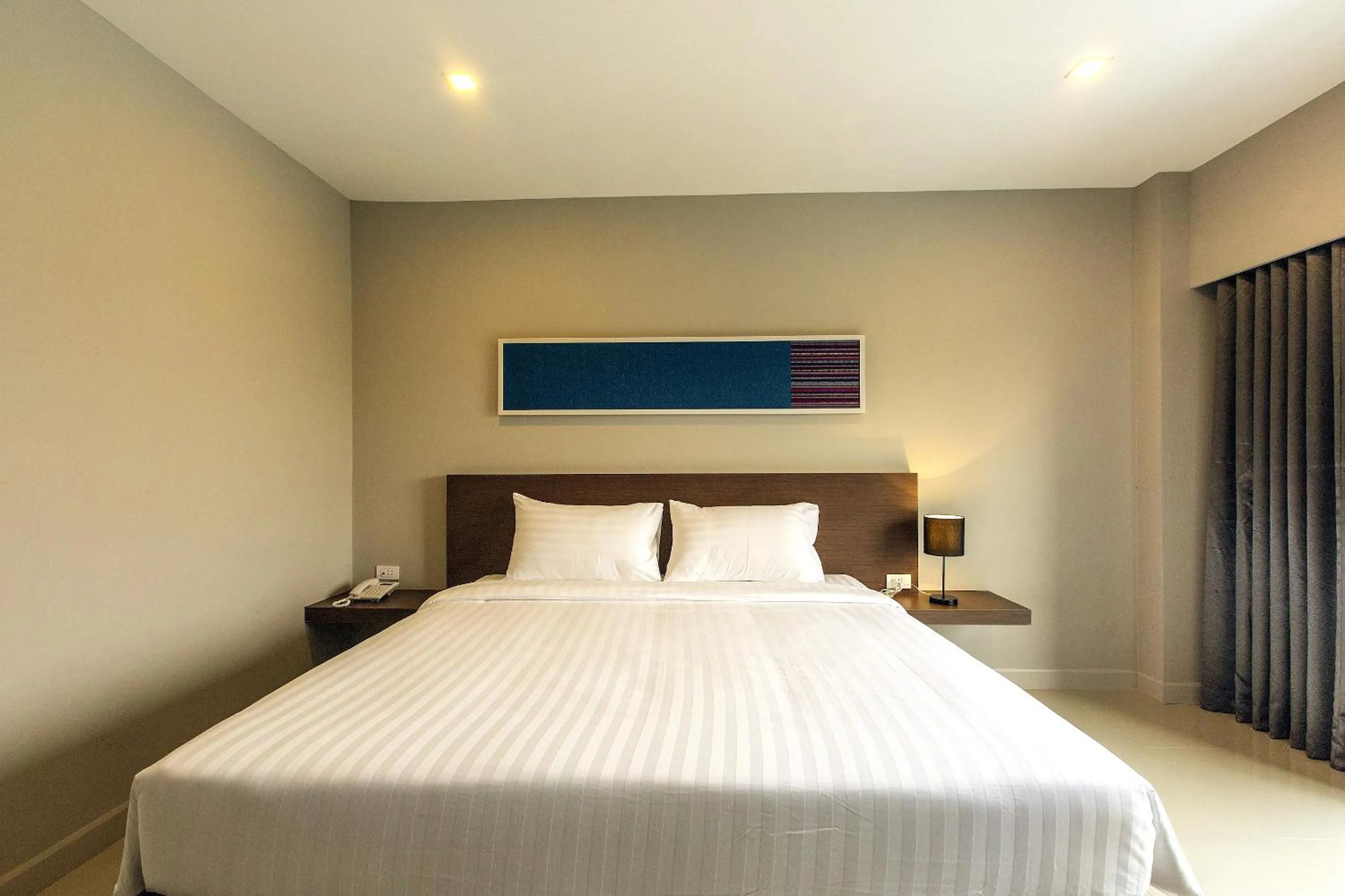 Photo of the whole room, Bed in V Hotel Ubon Ratchathani