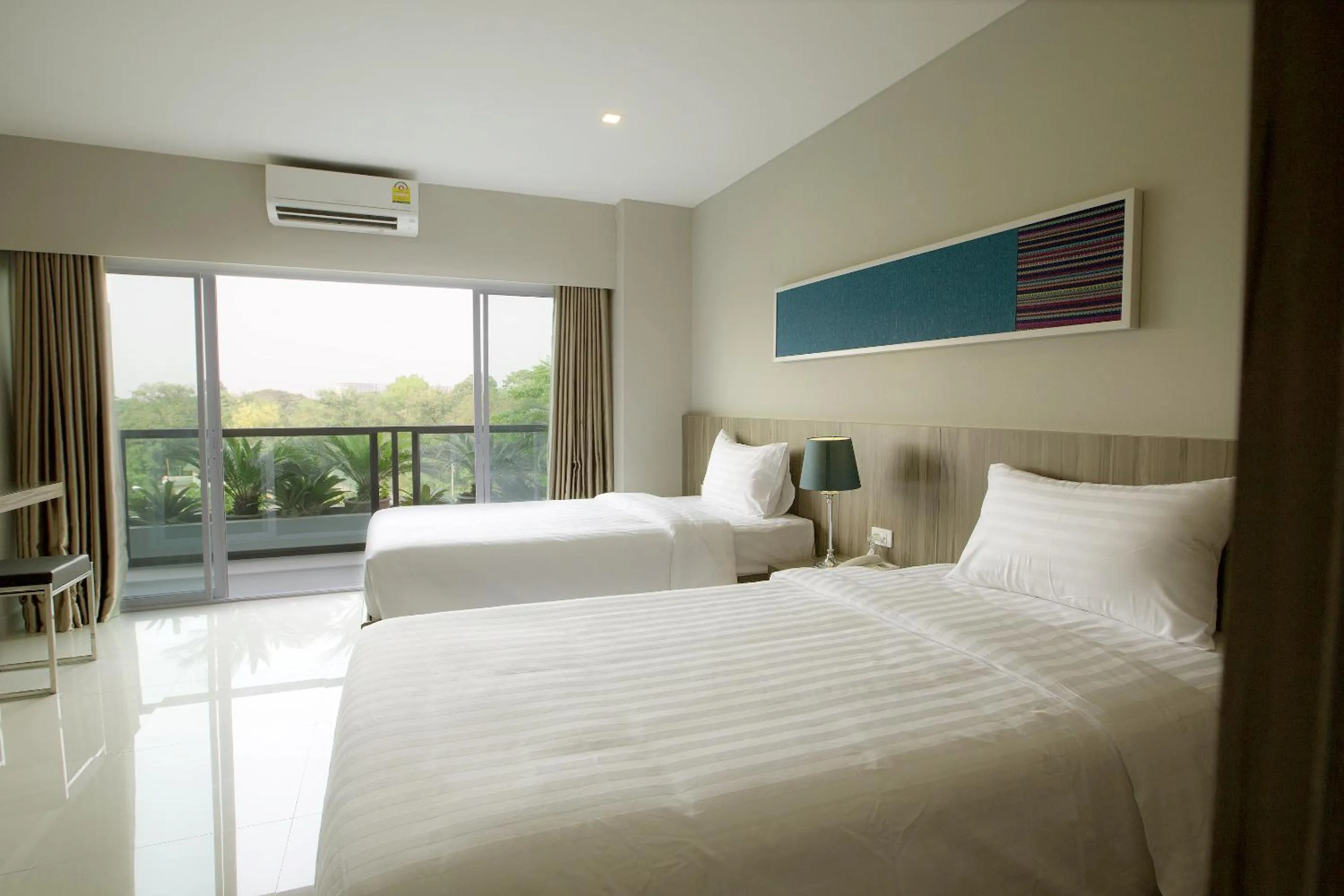 Photo of the whole room, Bed in V Hotel Ubon Ratchathani