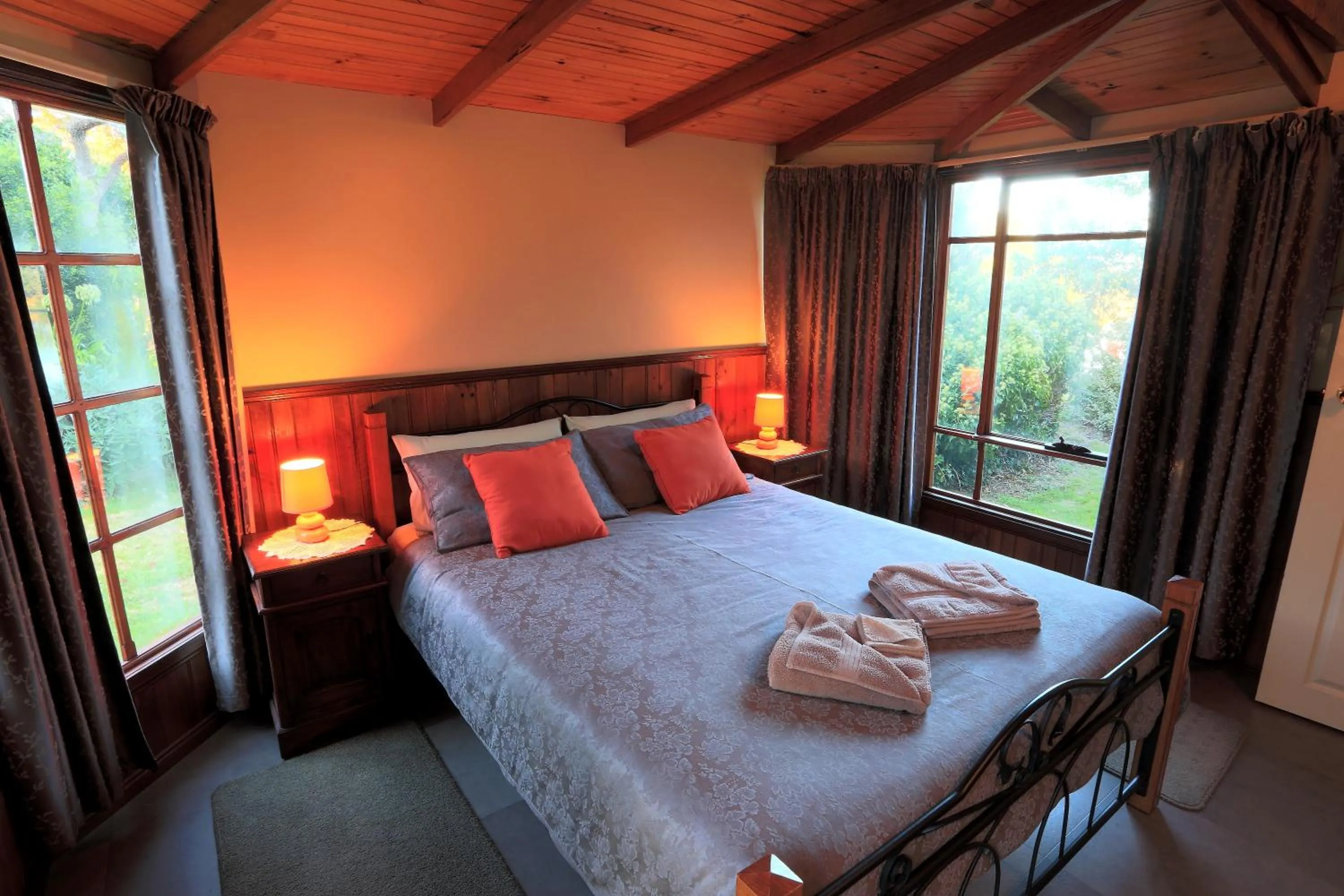 Bed in Stanley Lakeside Spa Cabins