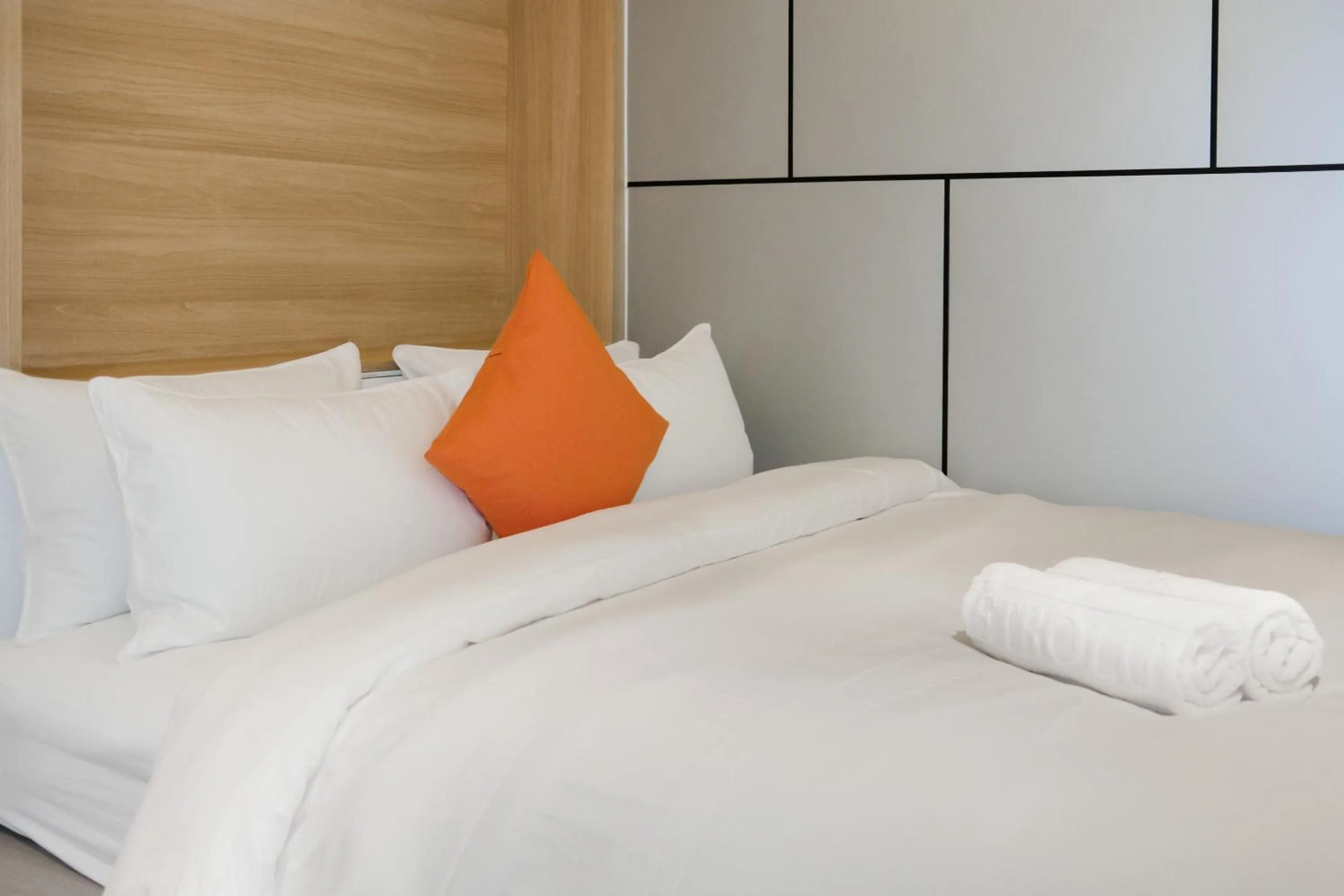 Bed in Metrolux City Contemporary Hotel