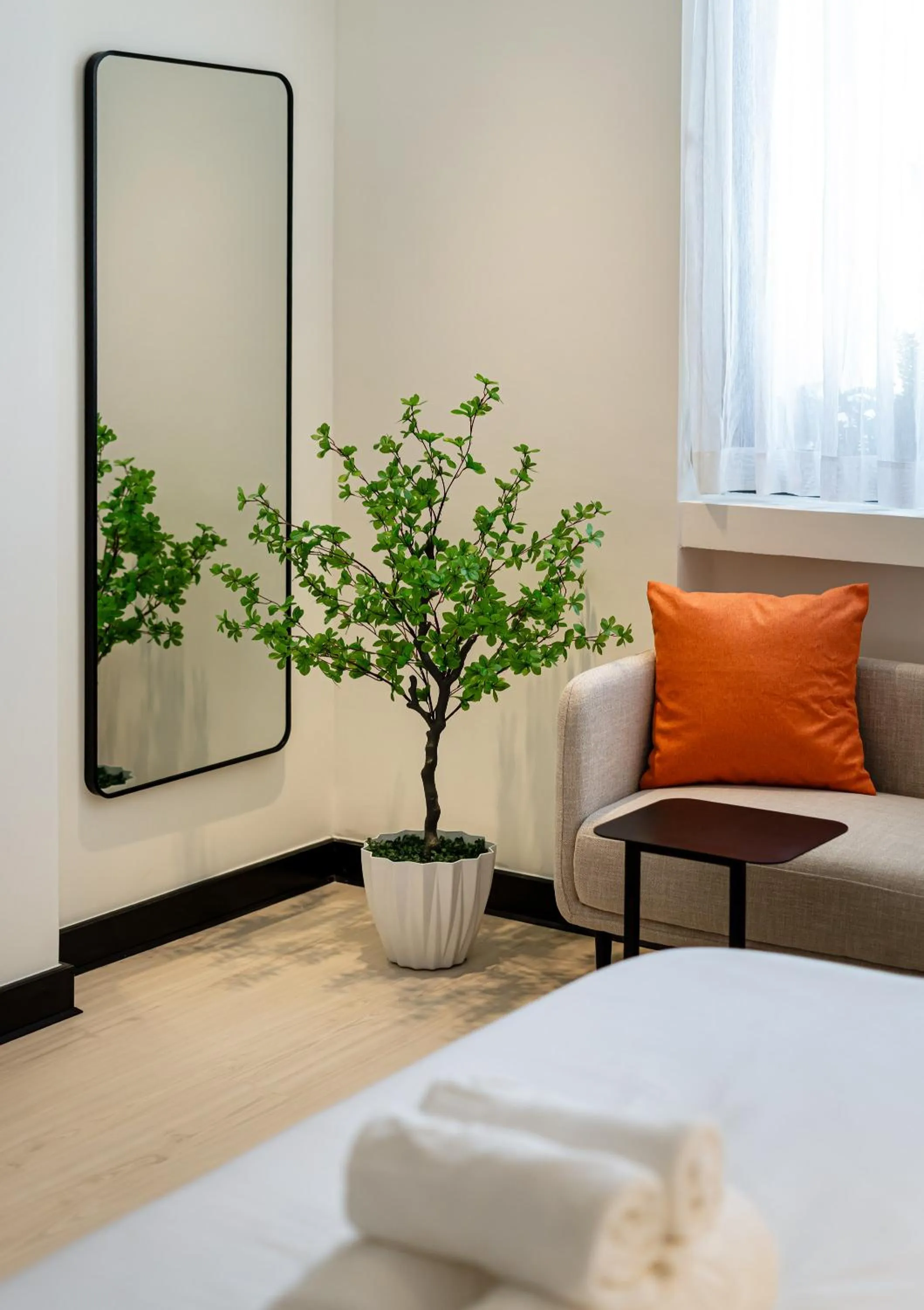 Seating area, Bed in Metrolux City Contemporary Hotel