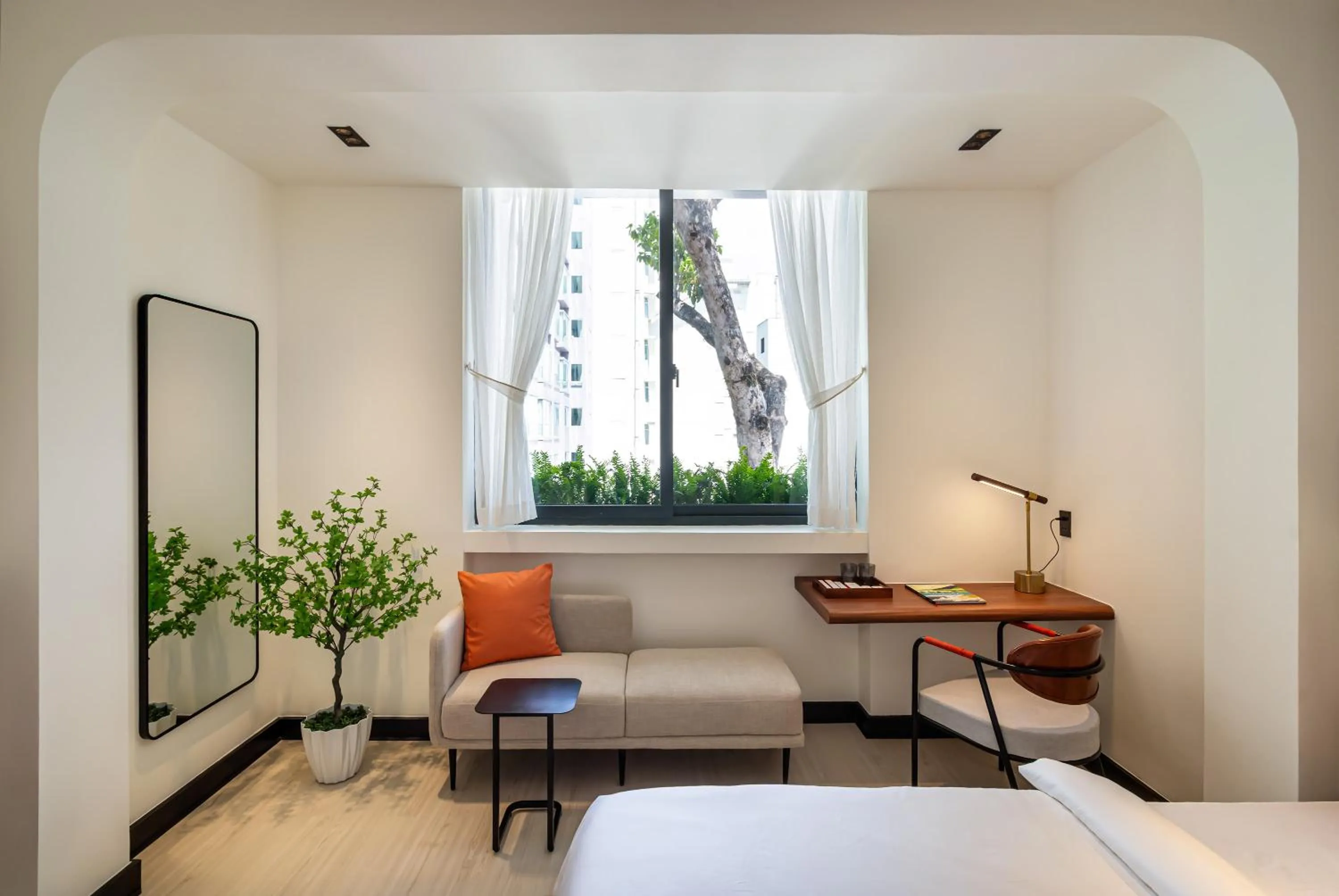 Living room, Bed in Metrolux City Contemporary Hotel