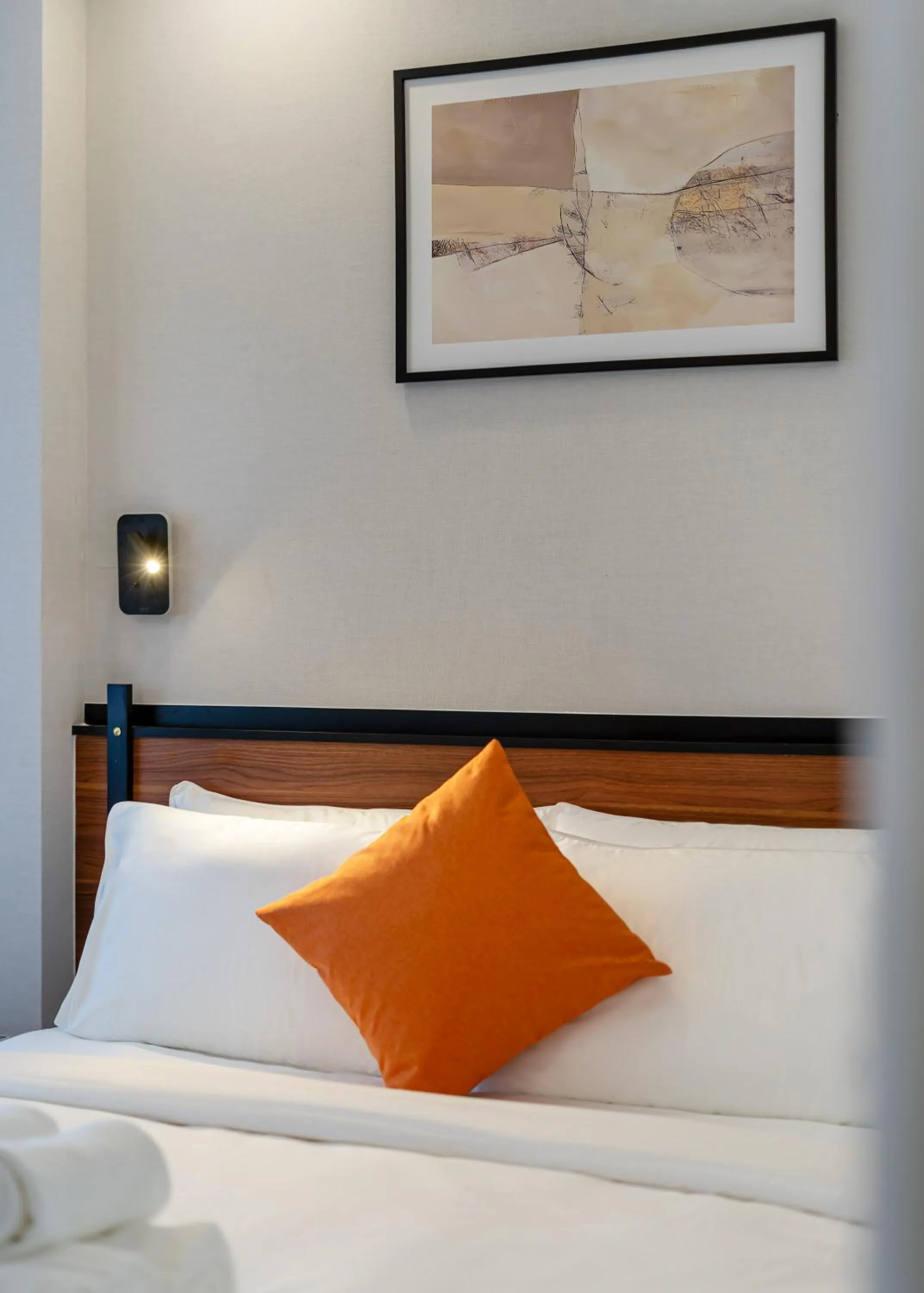 Bed in Metrolux City Contemporary Hotel