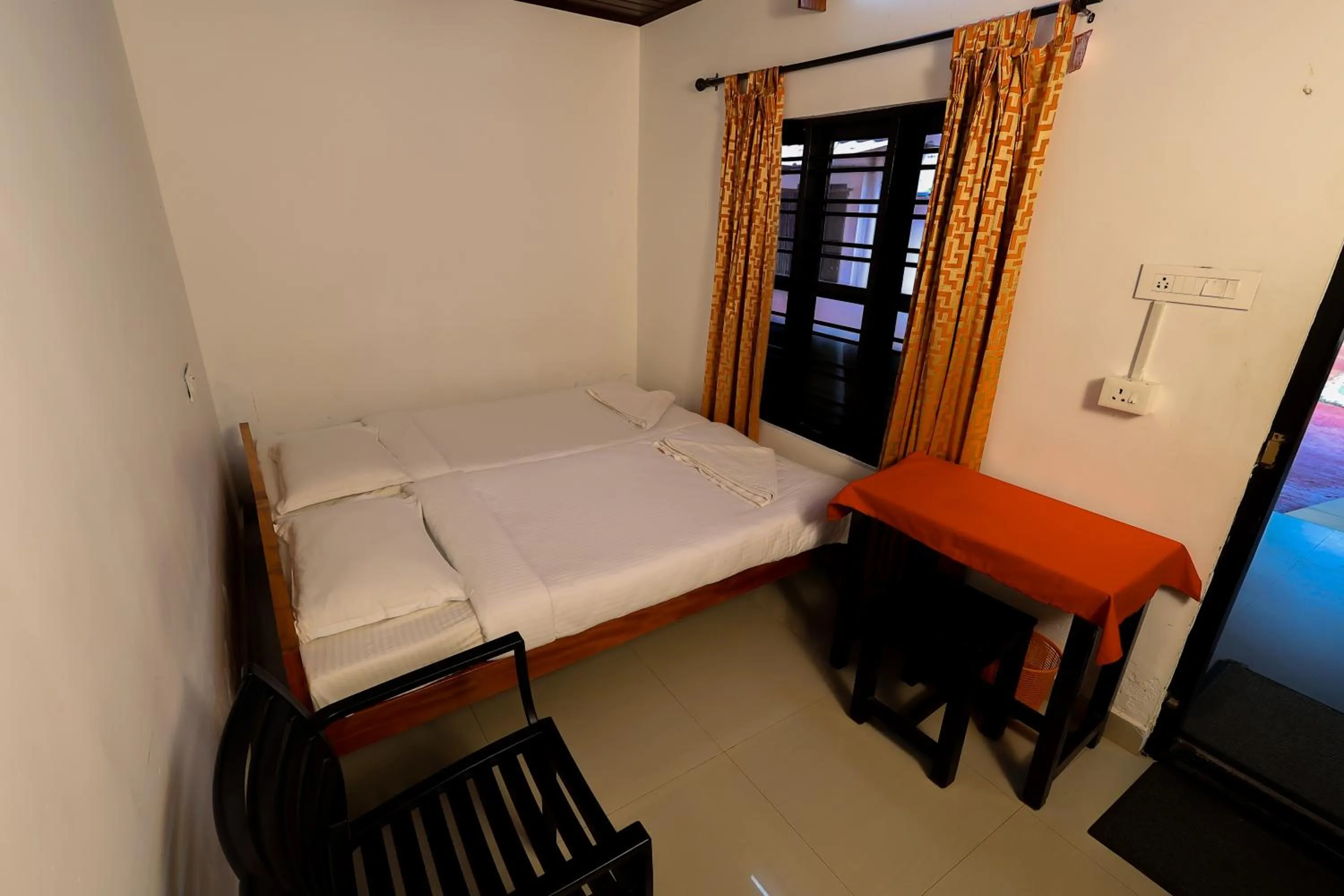 Bed in ILLIKKALAM Lakeside Cottages Kumarakom Kerala