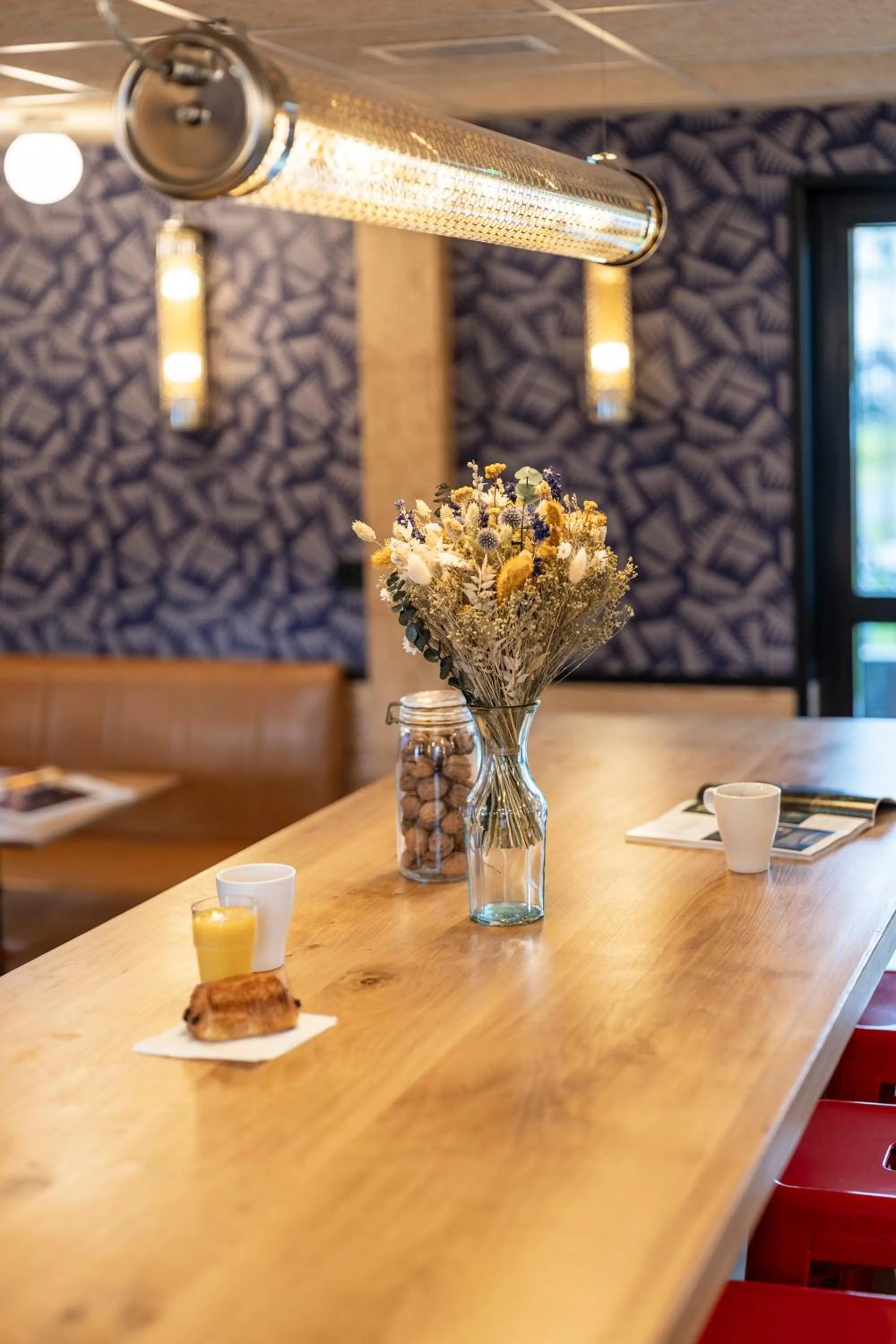 Communal lounge/ TV room in Eklo Hotels Le Havre