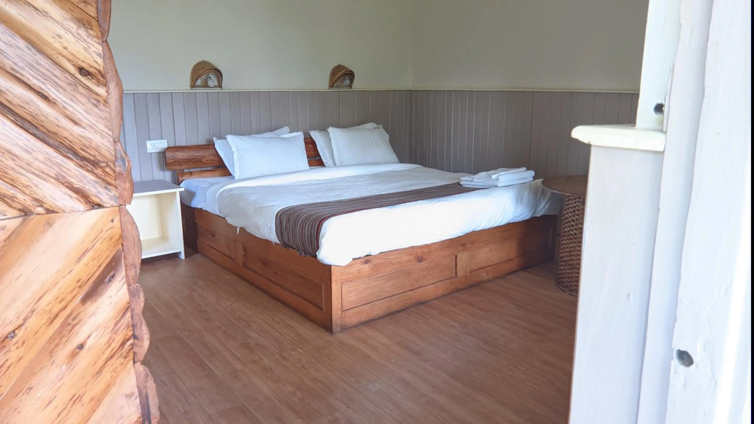 Bed in MayaTels - Maya Eco Huts, Pelling