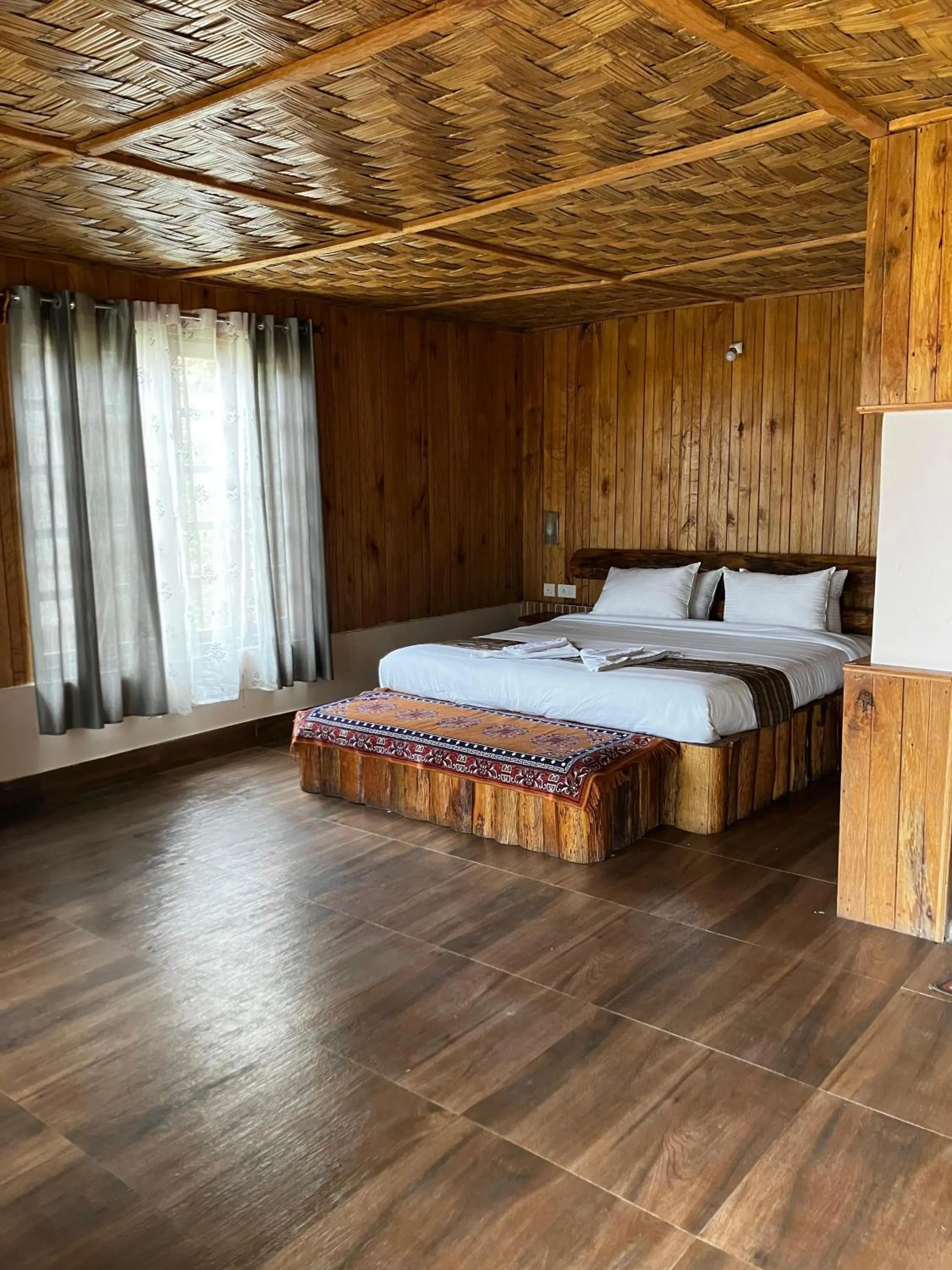 Bed in MayaTels - Maya Eco Huts, Pelling