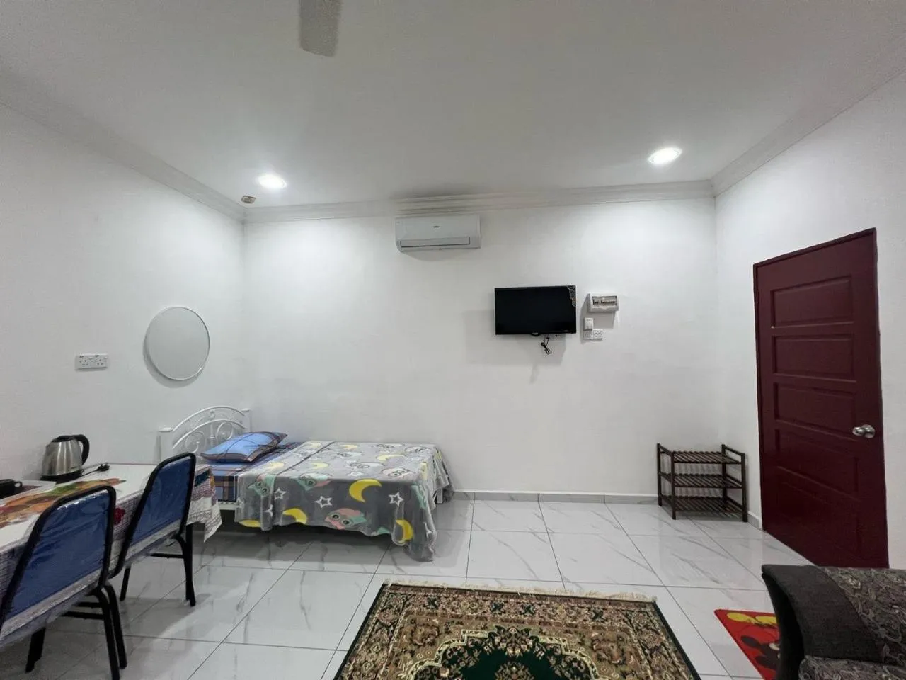 Bedroom in Capital O 91117 Noor Room Stay