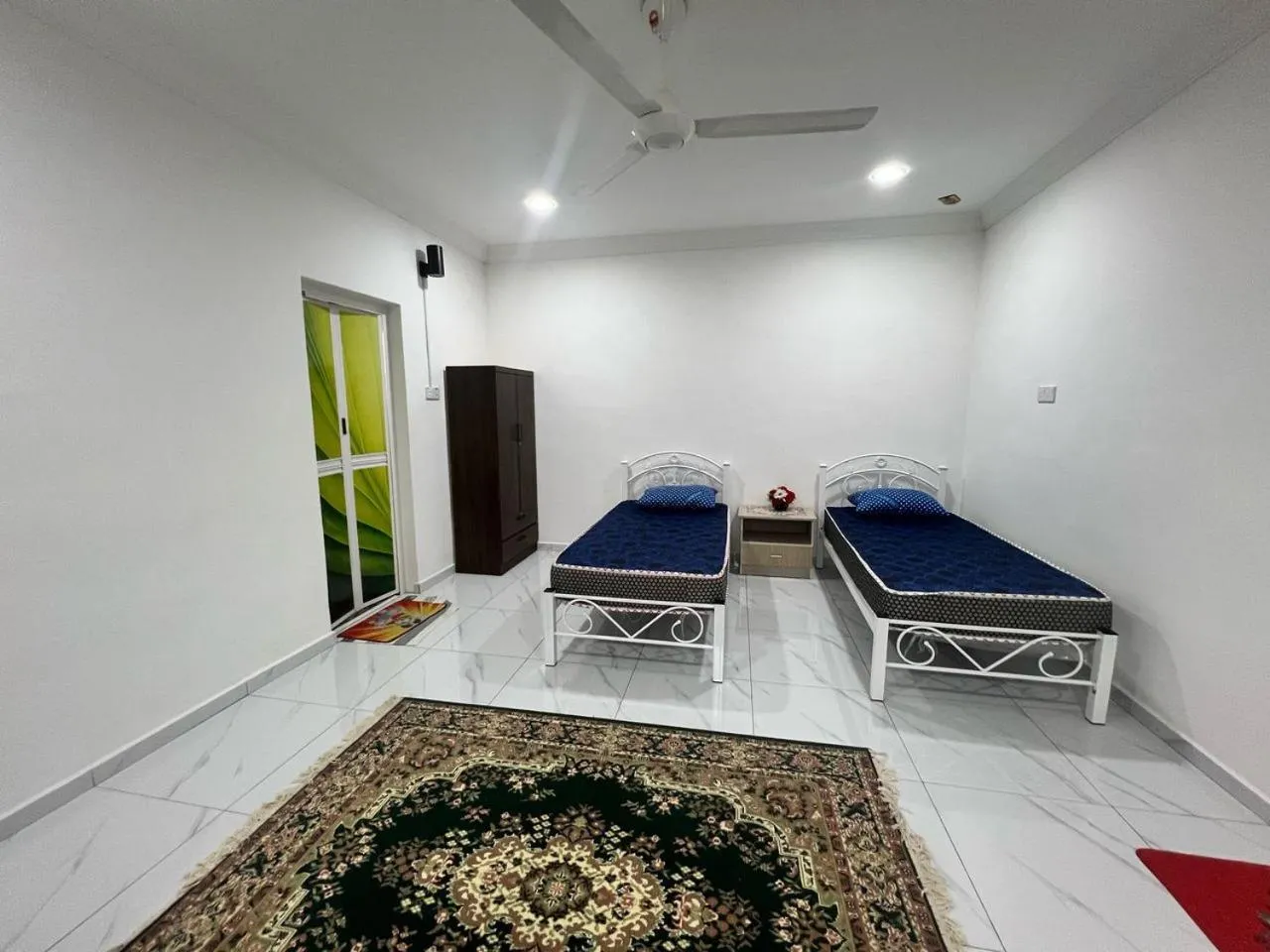 Bedroom in Capital O 91117 Noor Room Stay