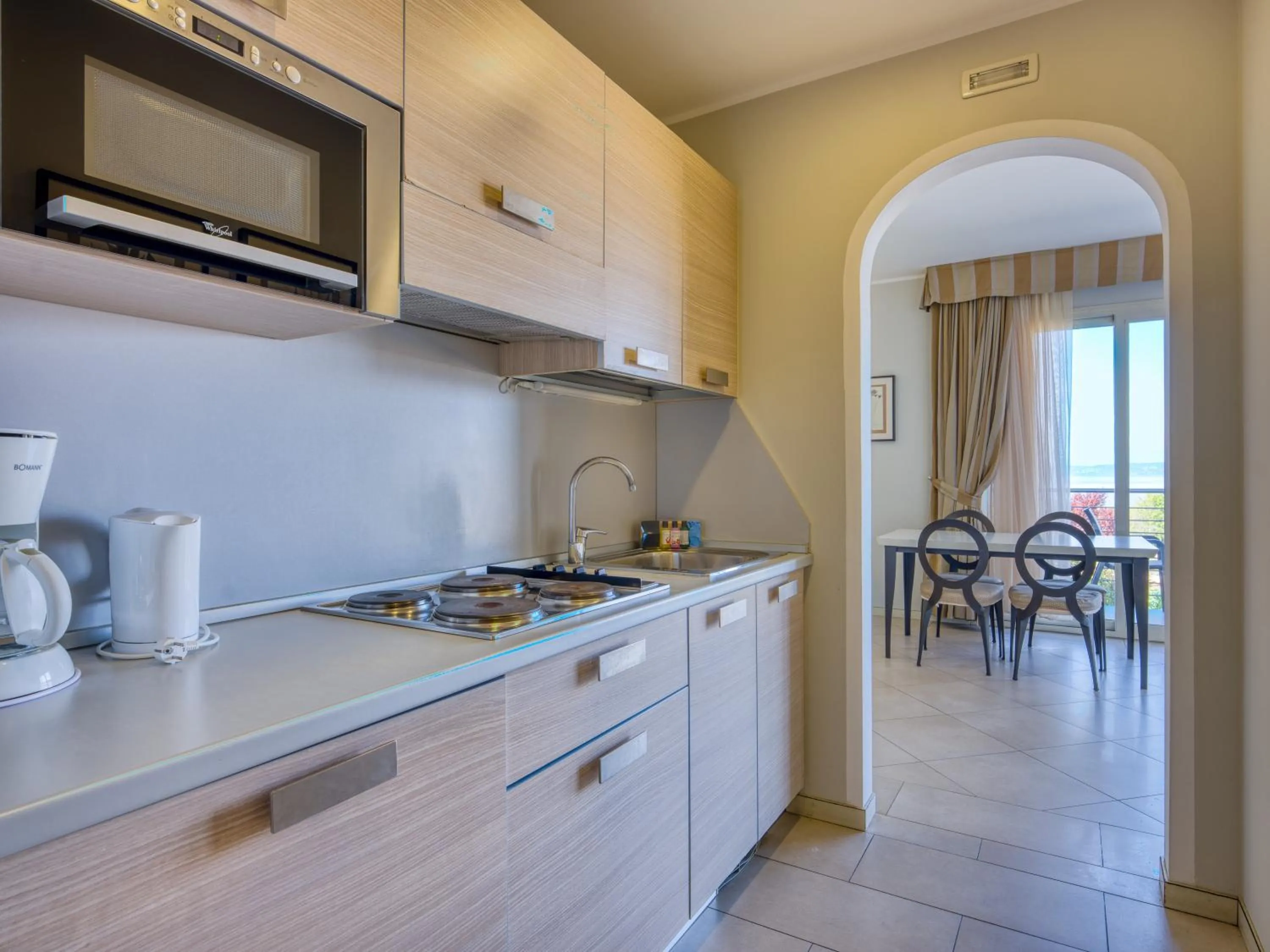 Kitchen or kitchenette in Parc Hotel Germano Suites & Apartments