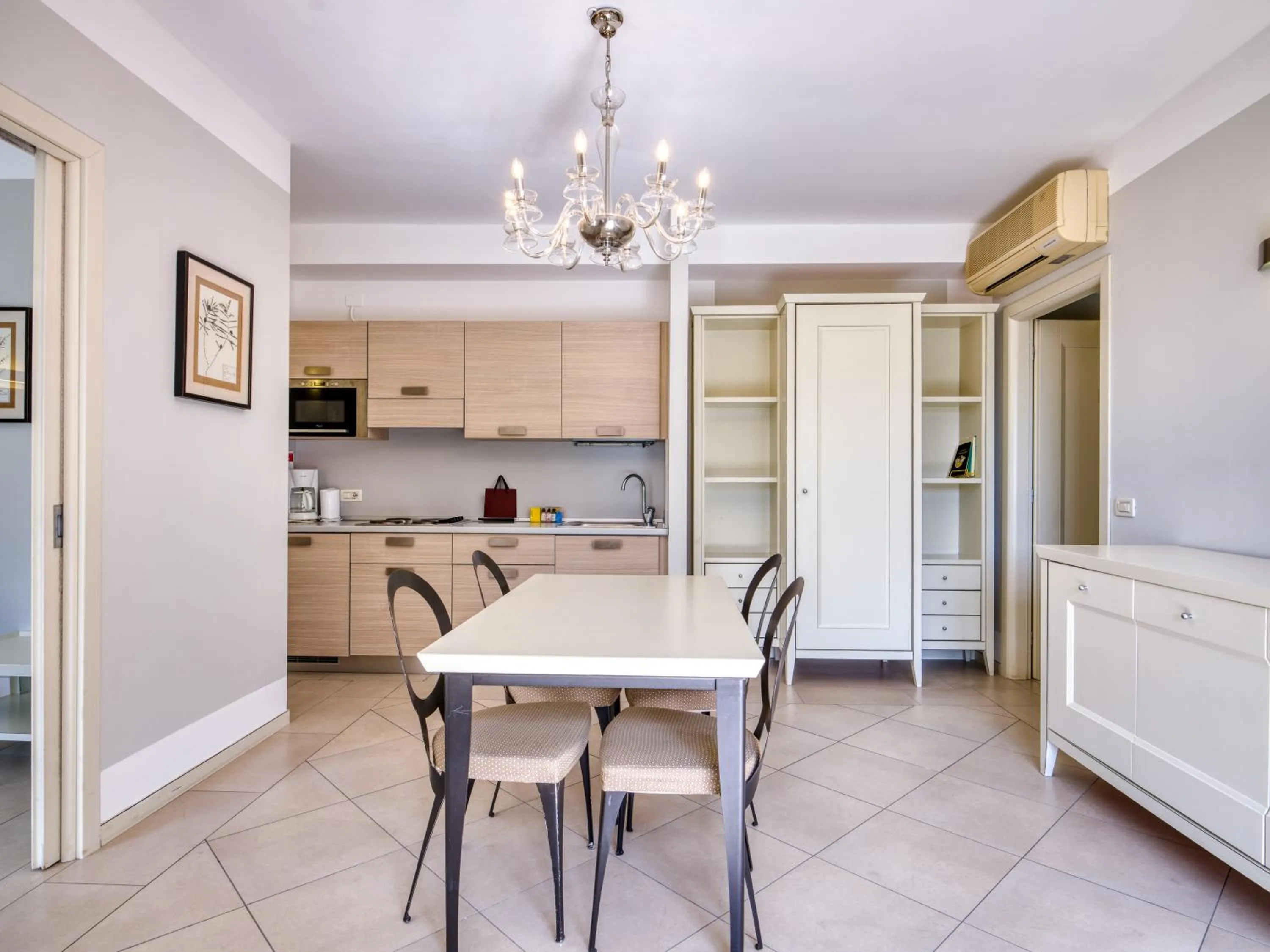 Kitchen or kitchenette in Parc Hotel Germano Suites & Apartments