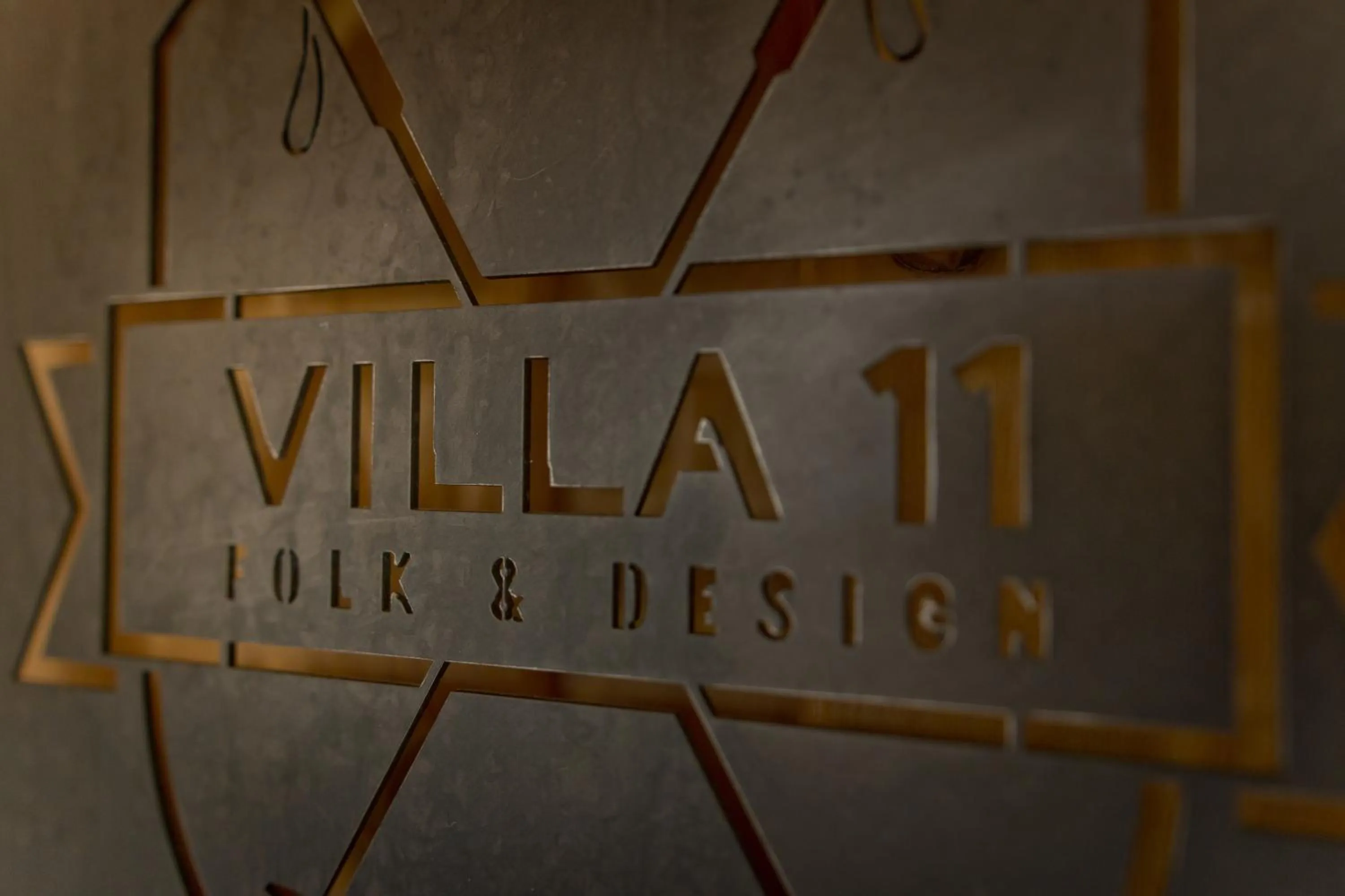 Property logo or sign in Villa 11 Folk & Design