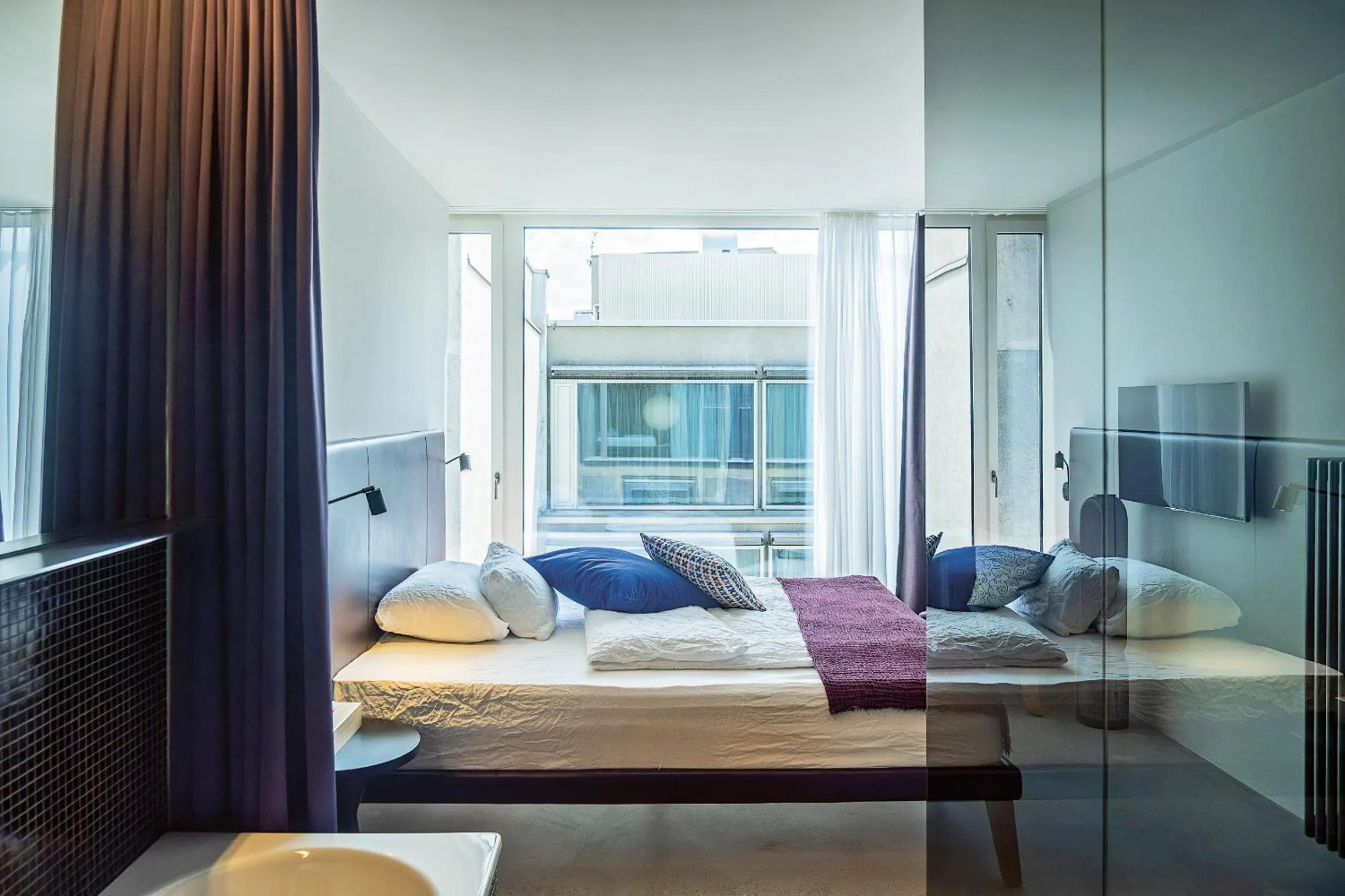 Bed in Nomad Design & Lifestyle Hotel