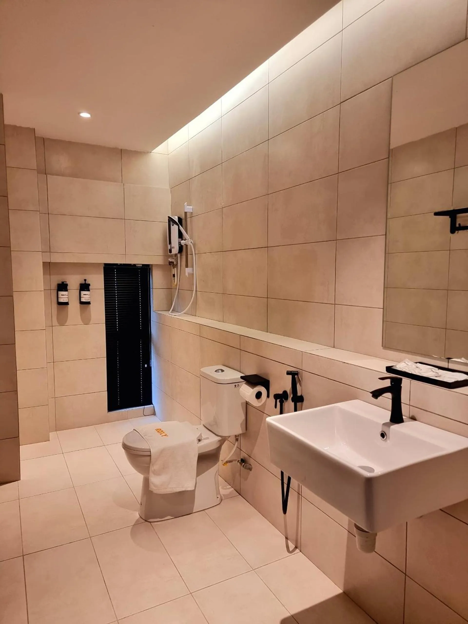 Bathroom in Roxy Hotel Malihah