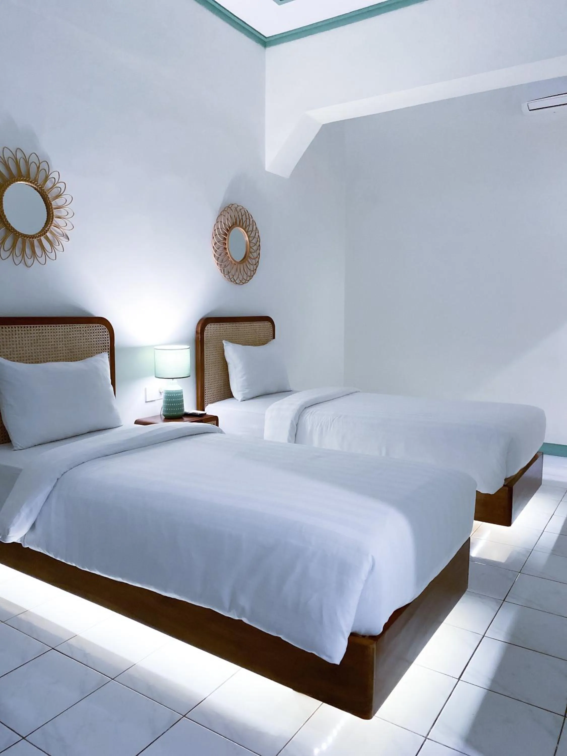 Bed in The Utara Hotel Tugu by Eresha Hospitality