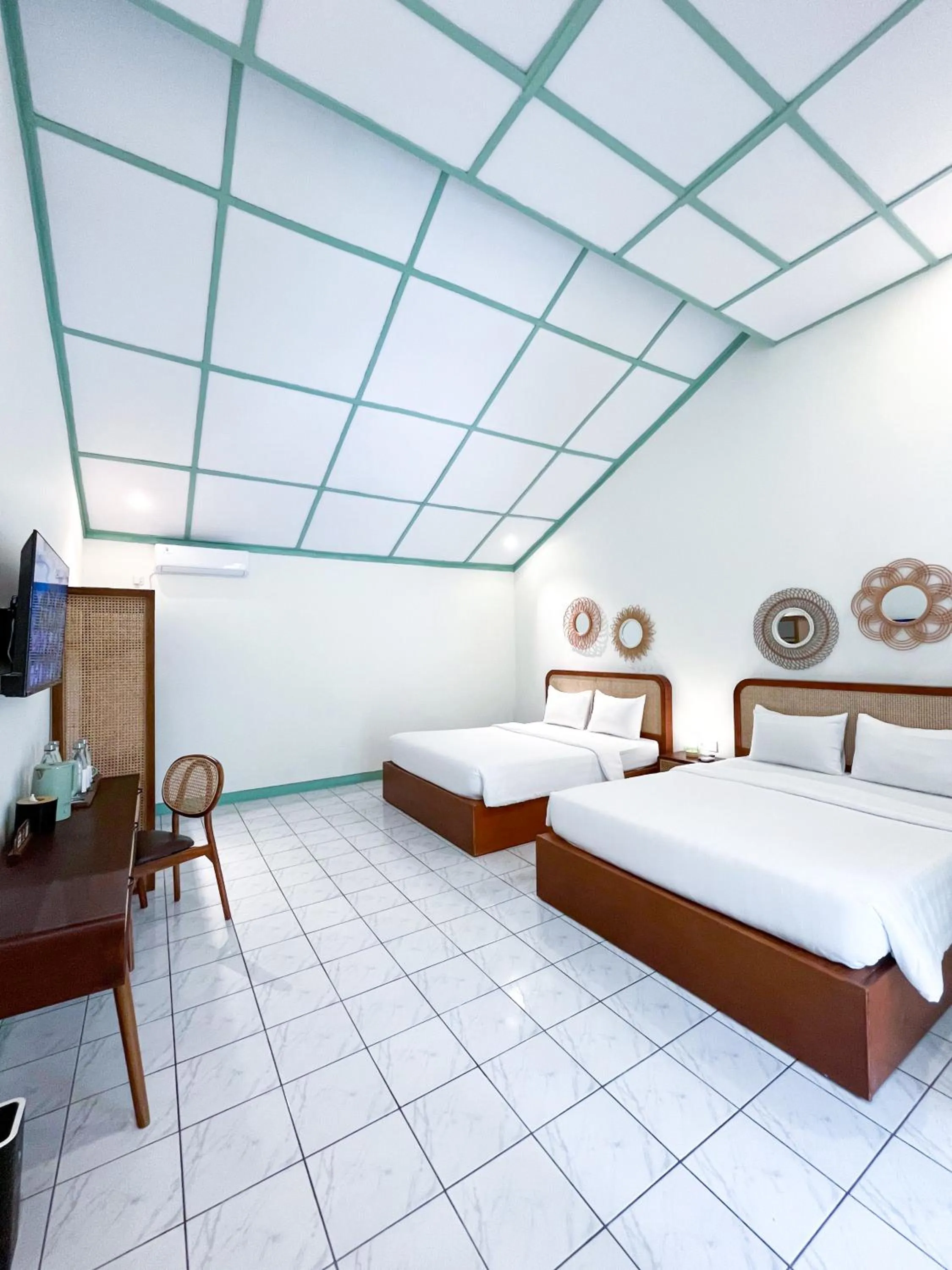 Bed in The Utara Hotel Tugu by Eresha Hospitality
