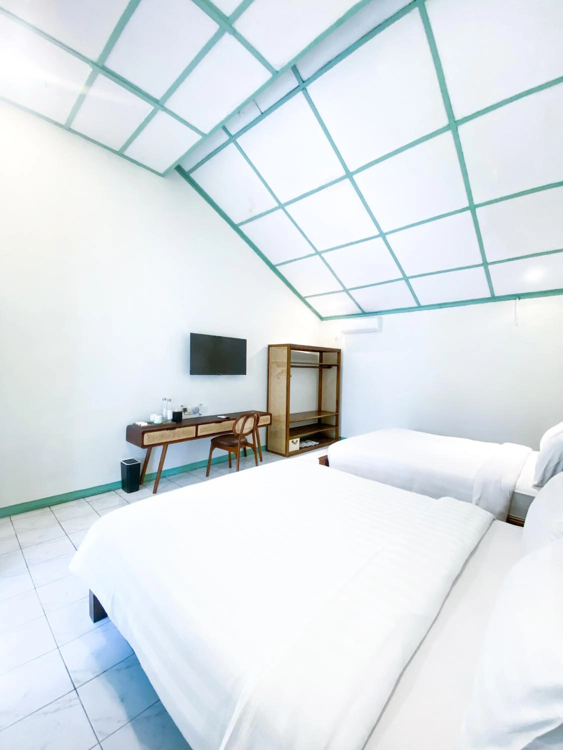 Bed in The Utara Hotel Tugu by Eresha Hospitality