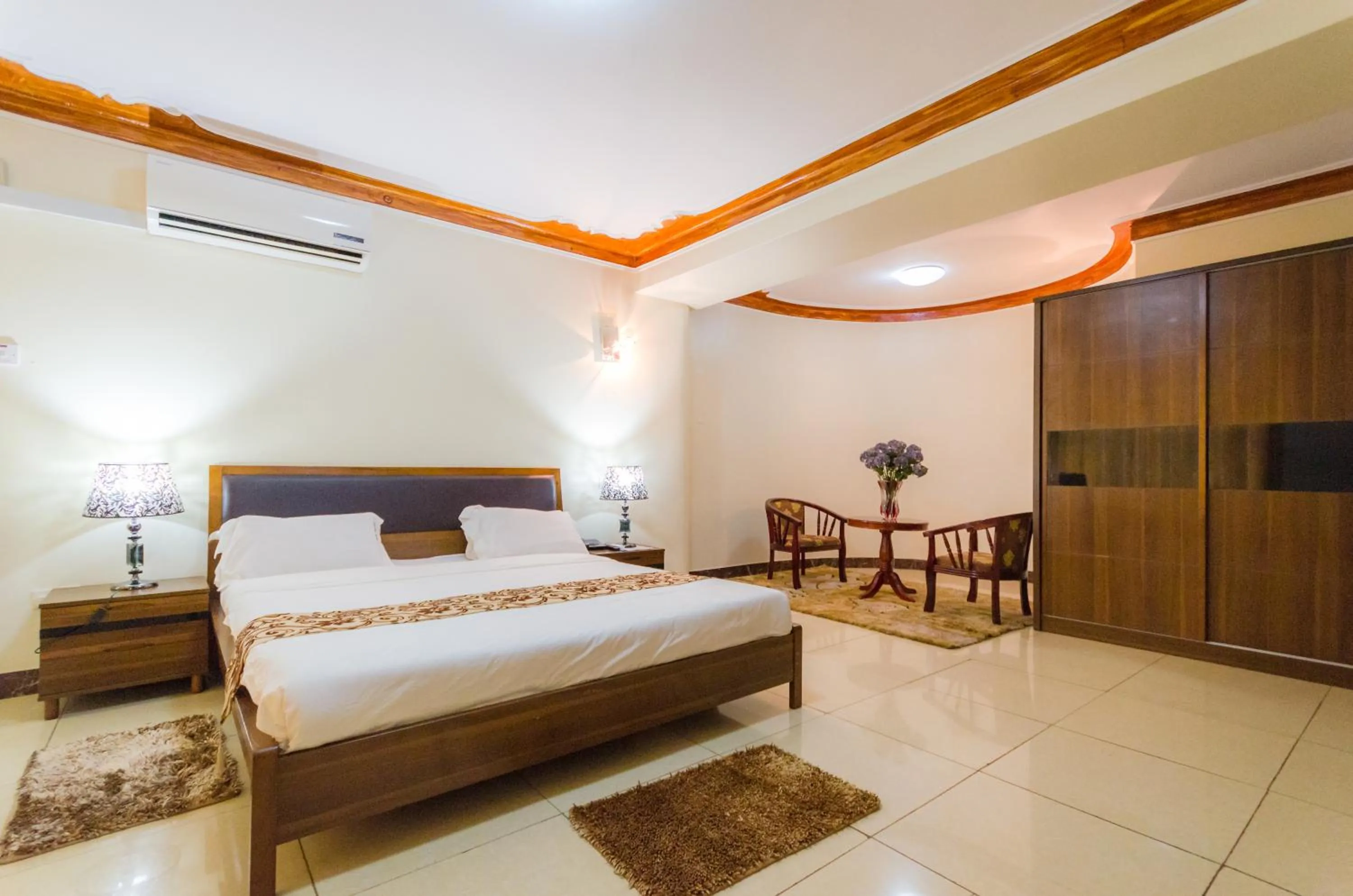 Seating area, Bed in Mt. Zion Hotel