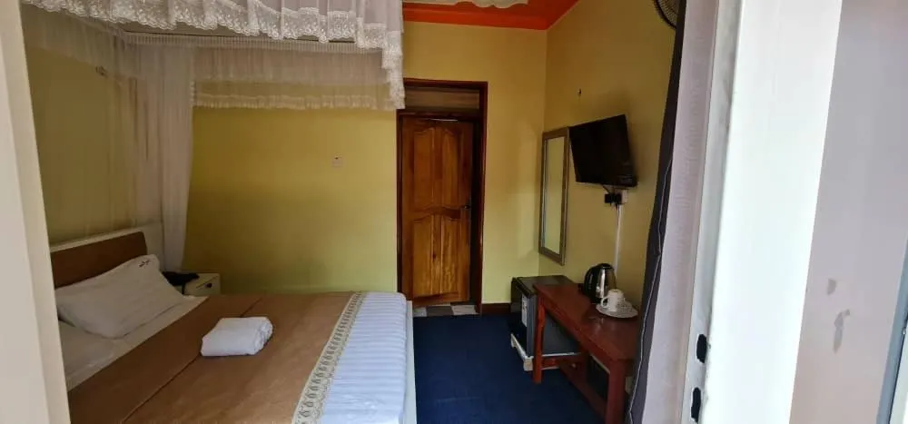 Bed in Meltonia Luxury Inn