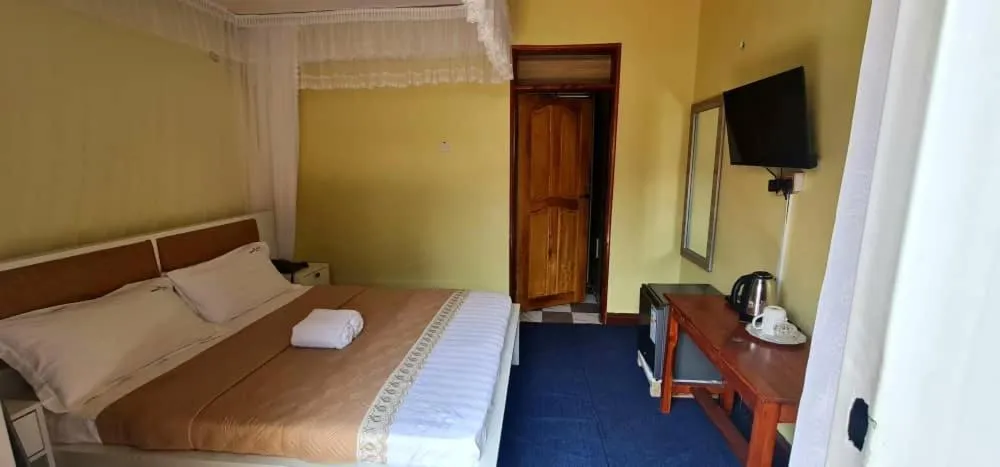 Bed in Meltonia Luxury Inn